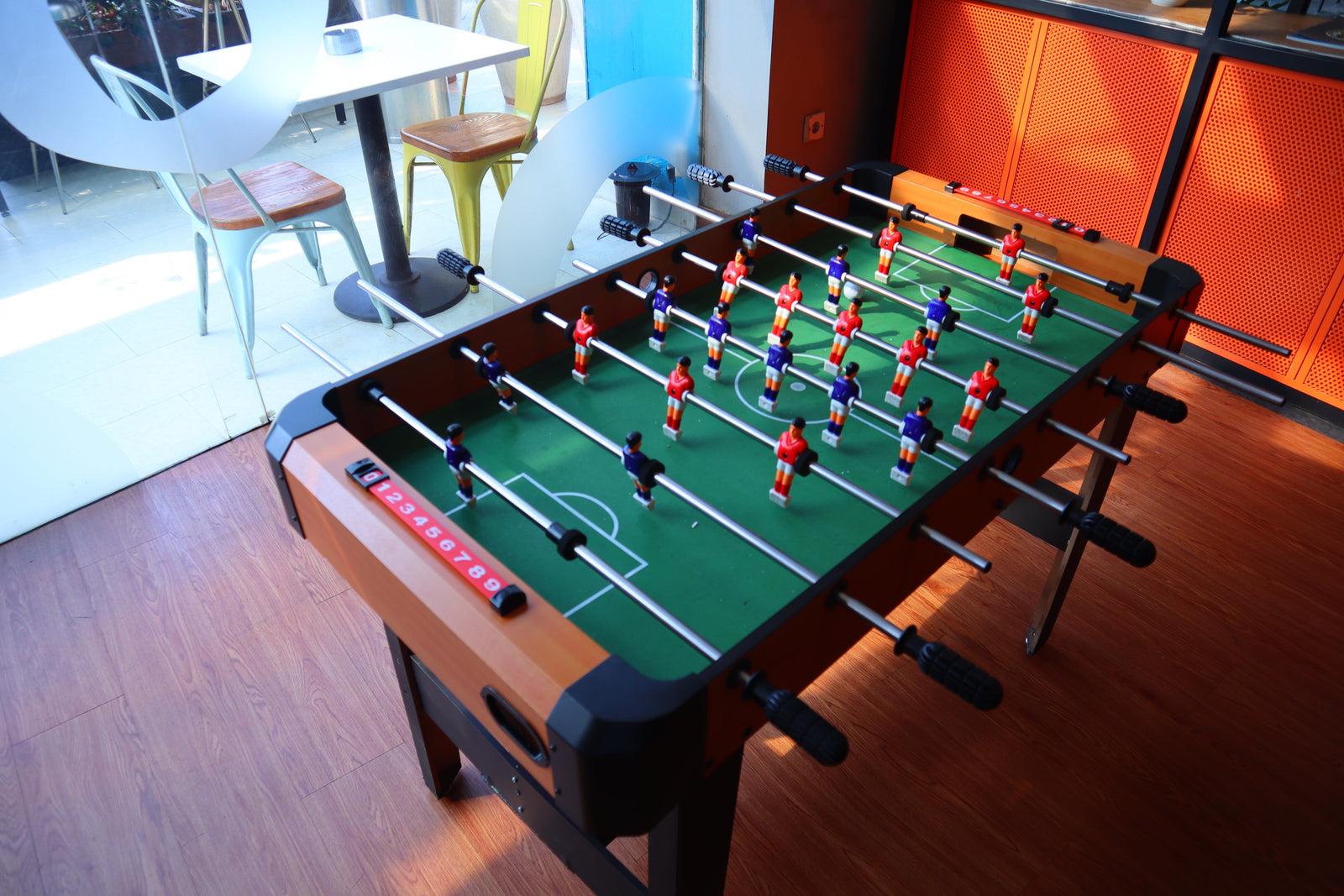 modern foosball tables in game room