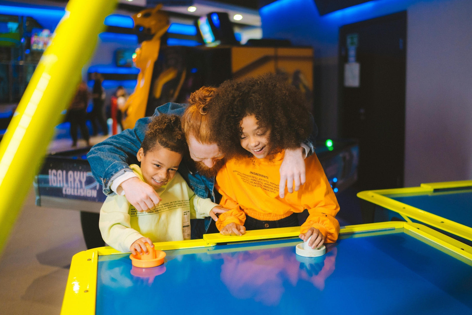 A Family Enjoying Air Hockey Together