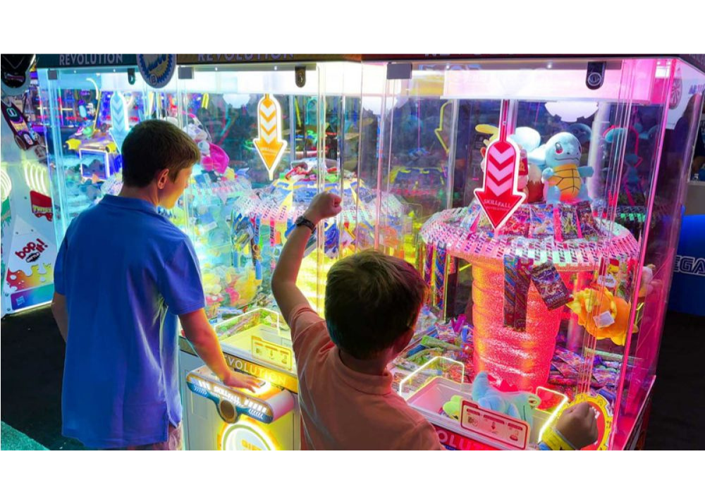 Skill Fall Revolution blue cabinet prize redemption arcade machine with vertical drop gameplay and illuminated prize compartments