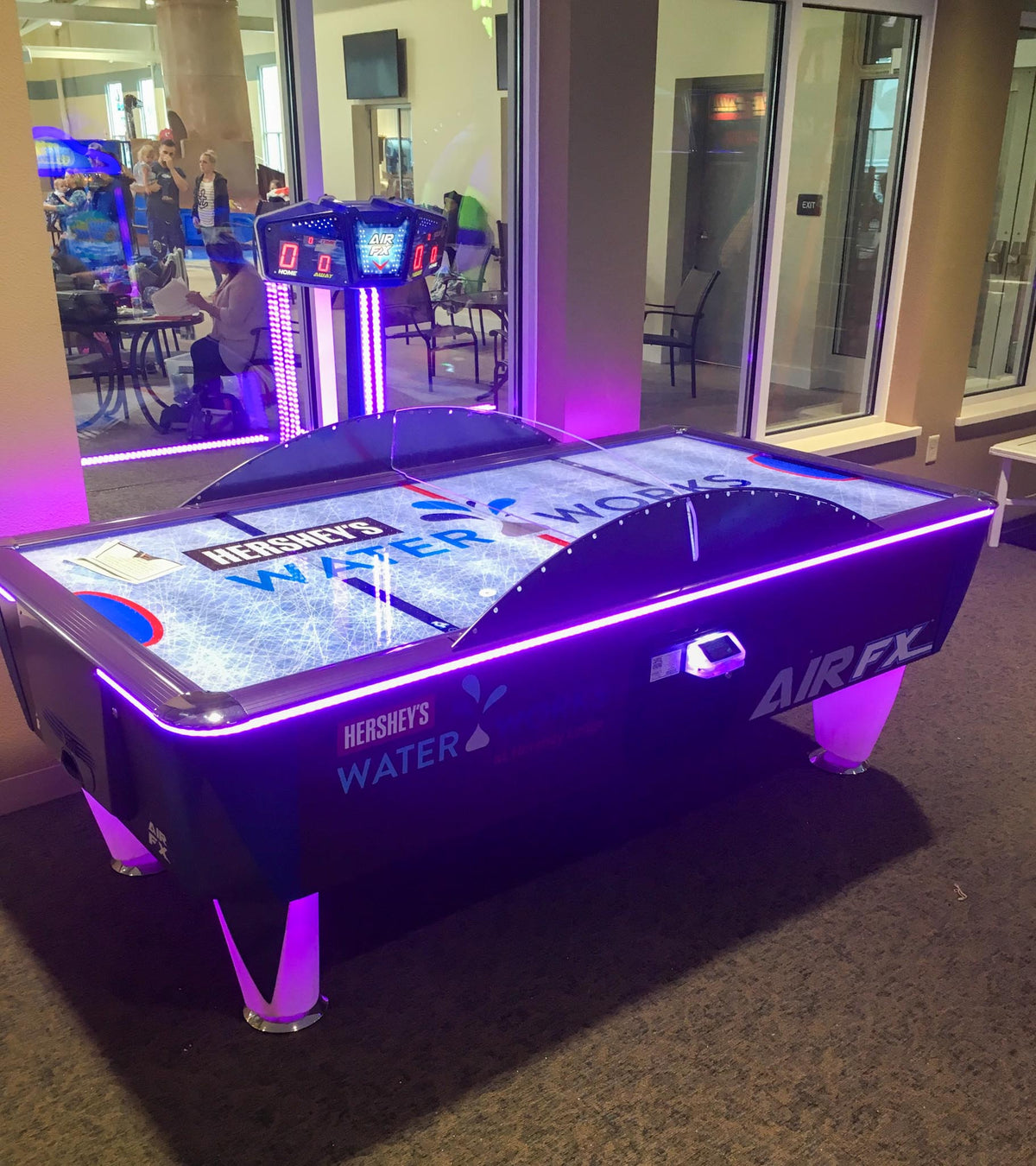 Air FX full-size 8-foot air hockey table with LED-lit playfield and ½-inch thick commercial-grade surface.