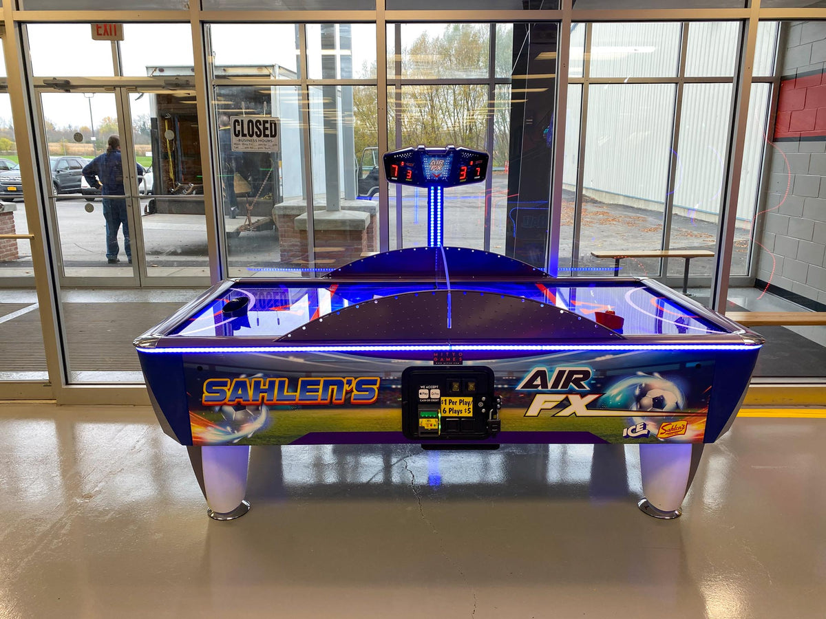 Air FX full-size 8-foot air hockey table with LED-lit playfield and ½-inch thick commercial-grade surface.