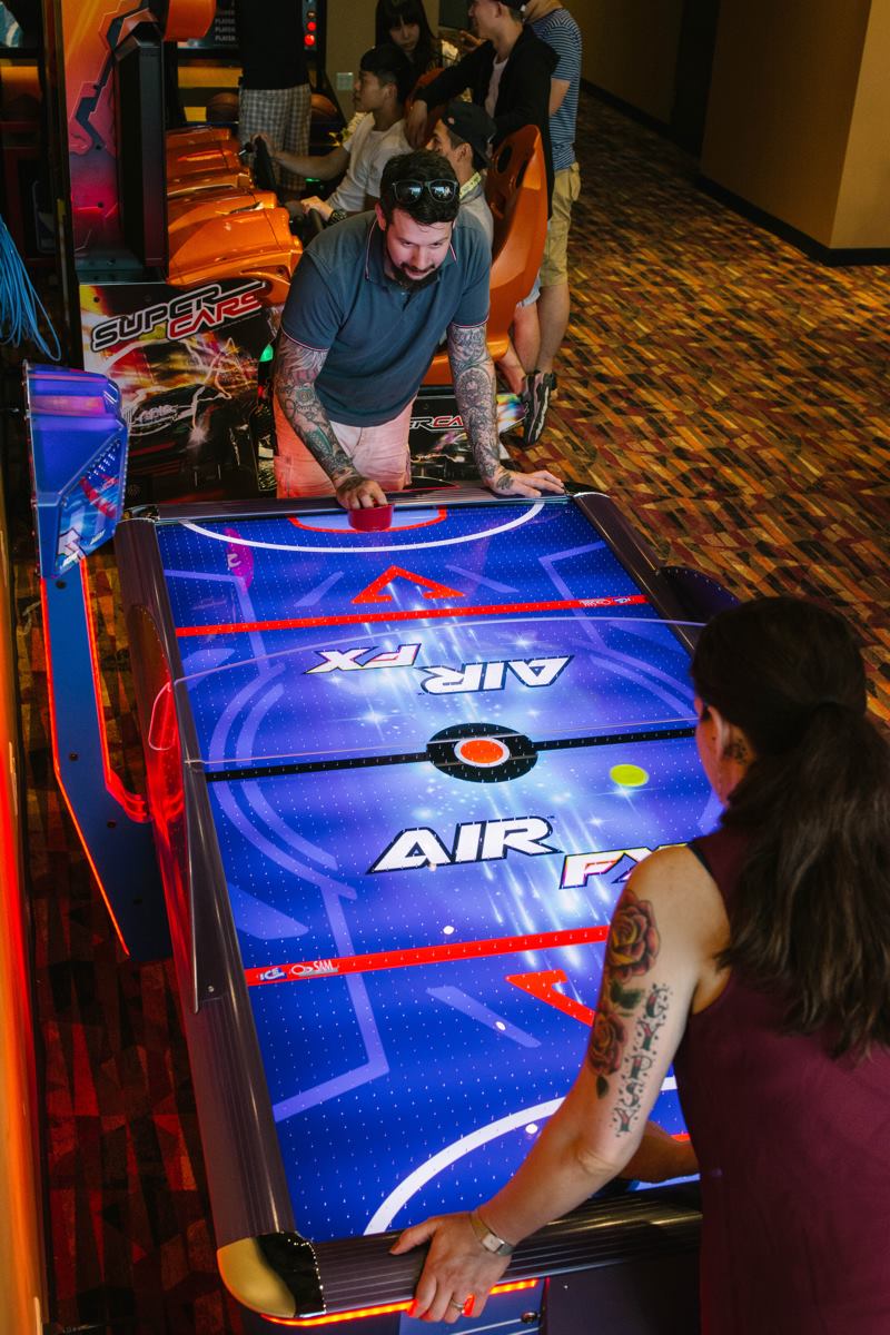 Air FX full-size 8-foot air hockey table with LED-lit playfield and ½-inch thick commercial-grade surface.