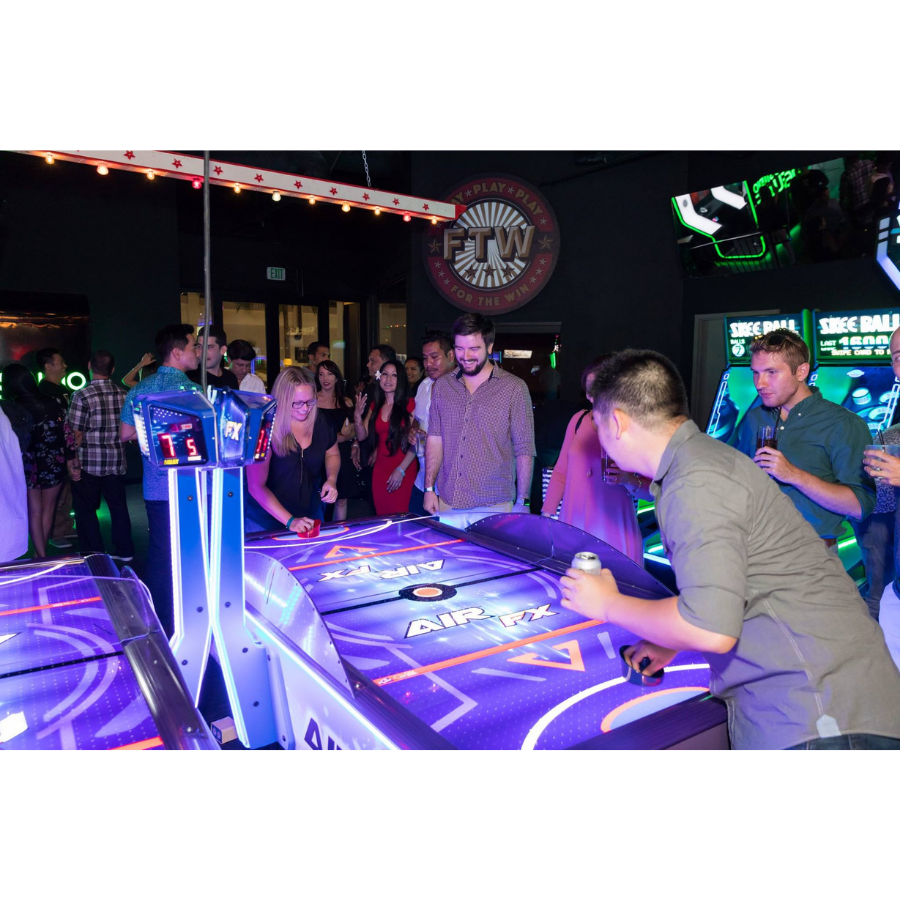 Air FX full-size 8-foot air hockey table with LED-lit playfield and ½-inch thick commercial-grade surface.