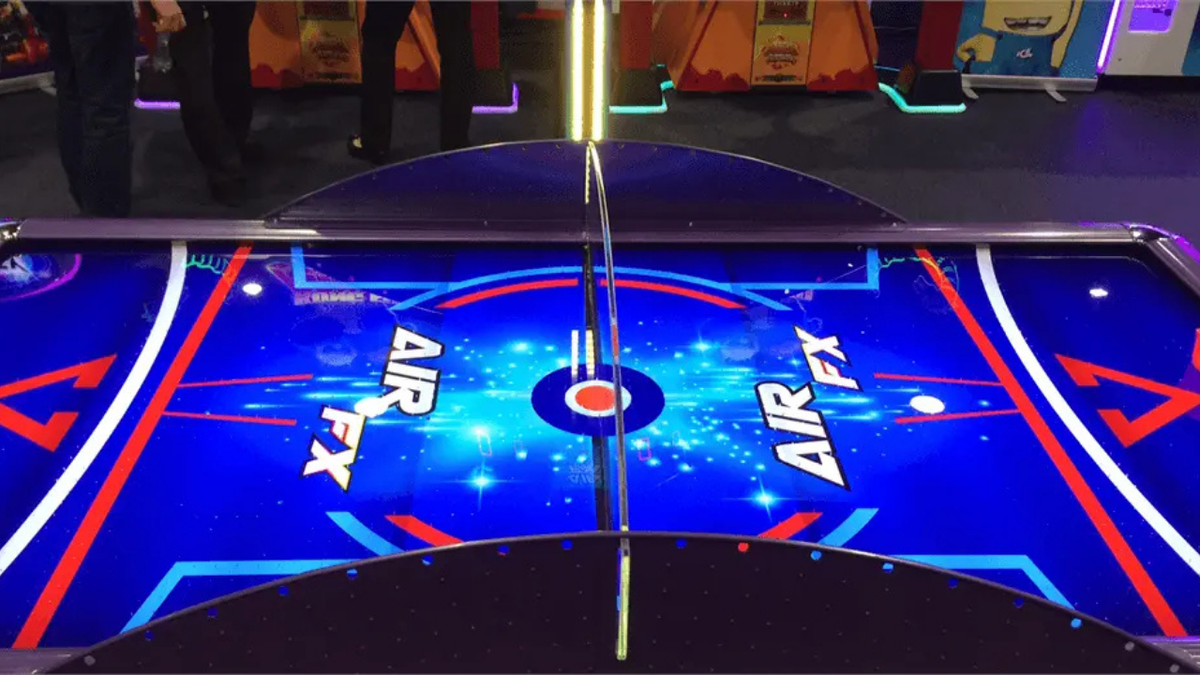 Air FX full-size 8-foot air hockey table with LED-lit playfield and ½-inch thick commercial-grade surface.