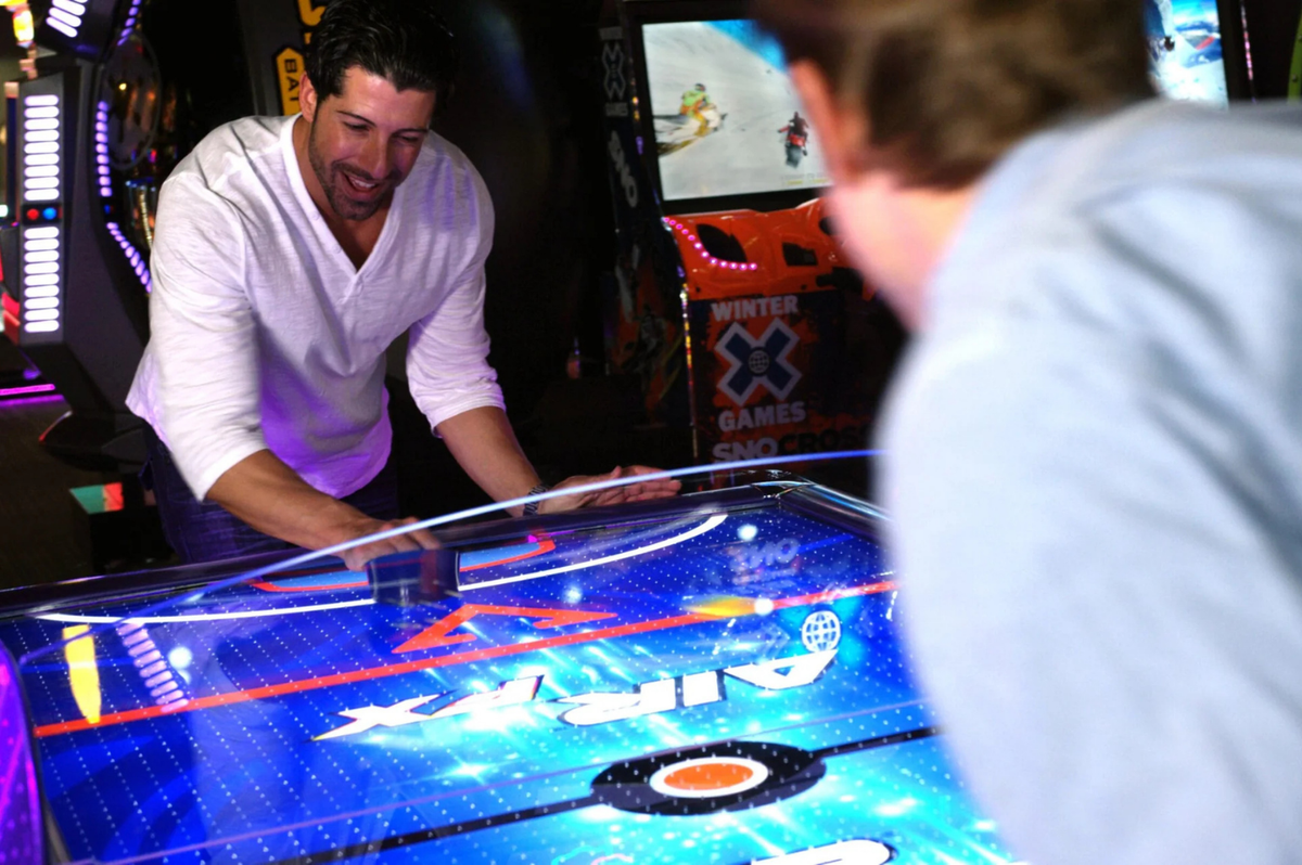 Air FX full-size 8-foot air hockey table with LED-lit playfield and ½-inch thick commercial-grade surface.