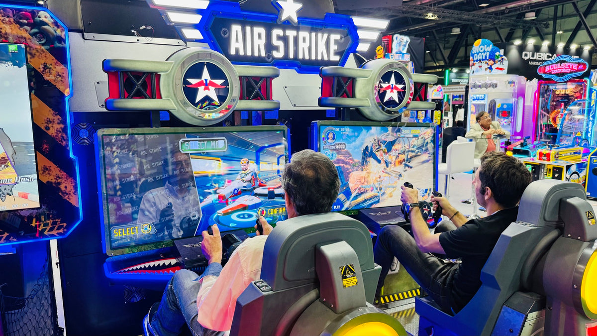 Air Strike arcade machine with 2-player flying simulator, pendulum motion seats, and optional ticket redemption.
