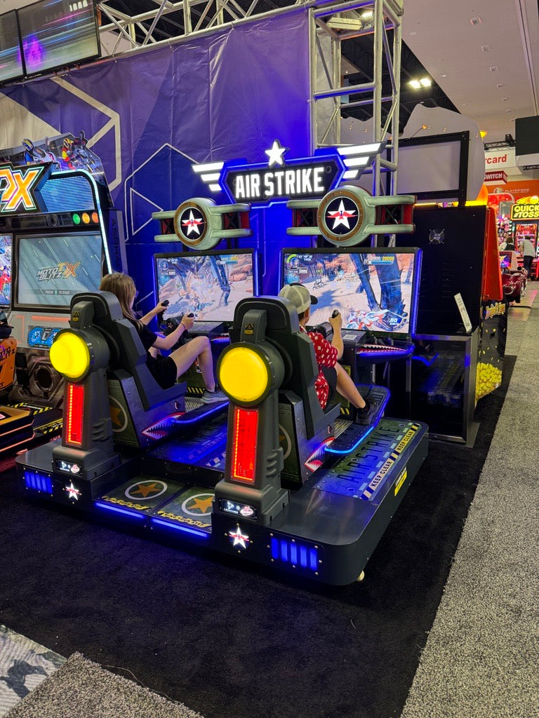 Air Strike arcade machine with 2-player flying simulator, pendulum motion seats, and optional ticket redemption.