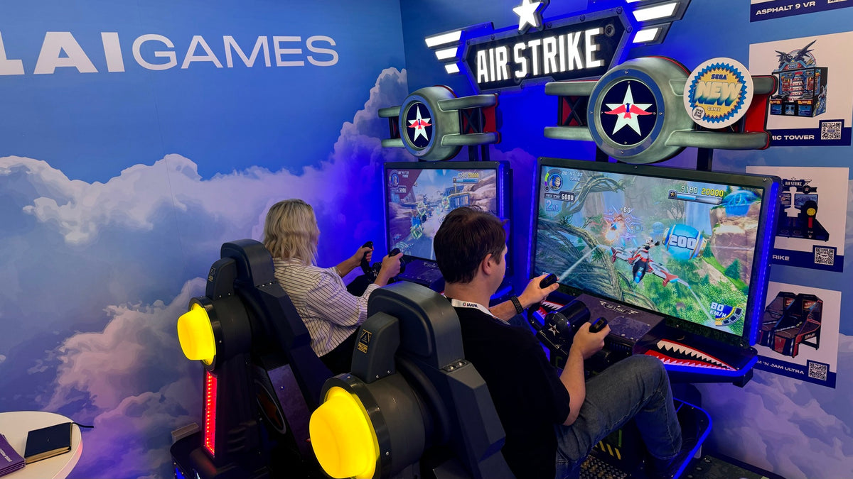 Air Strike arcade machine with 2-player flying simulator, pendulum motion seats, and optional ticket redemption.