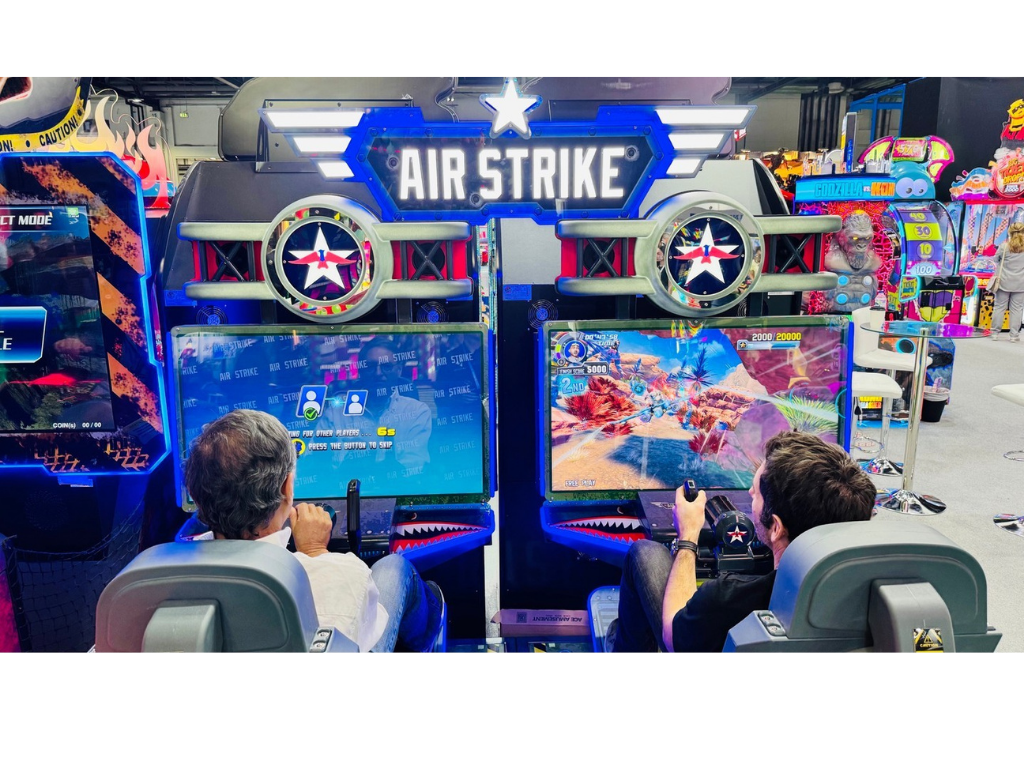 Air Strike arcade machine with 2-player flying simulator, pendulum motion seats, and optional ticket redemption.