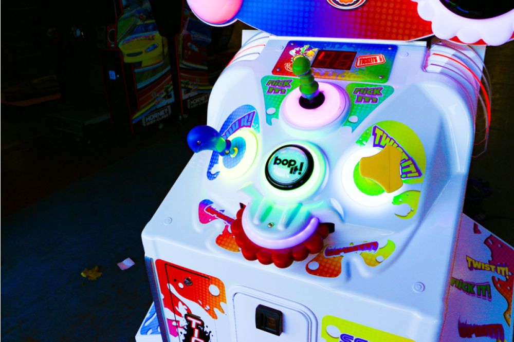 BOP IT! Arcade machine by Sega and Hasbro featuring large interactive buttons and skill-based gameplay