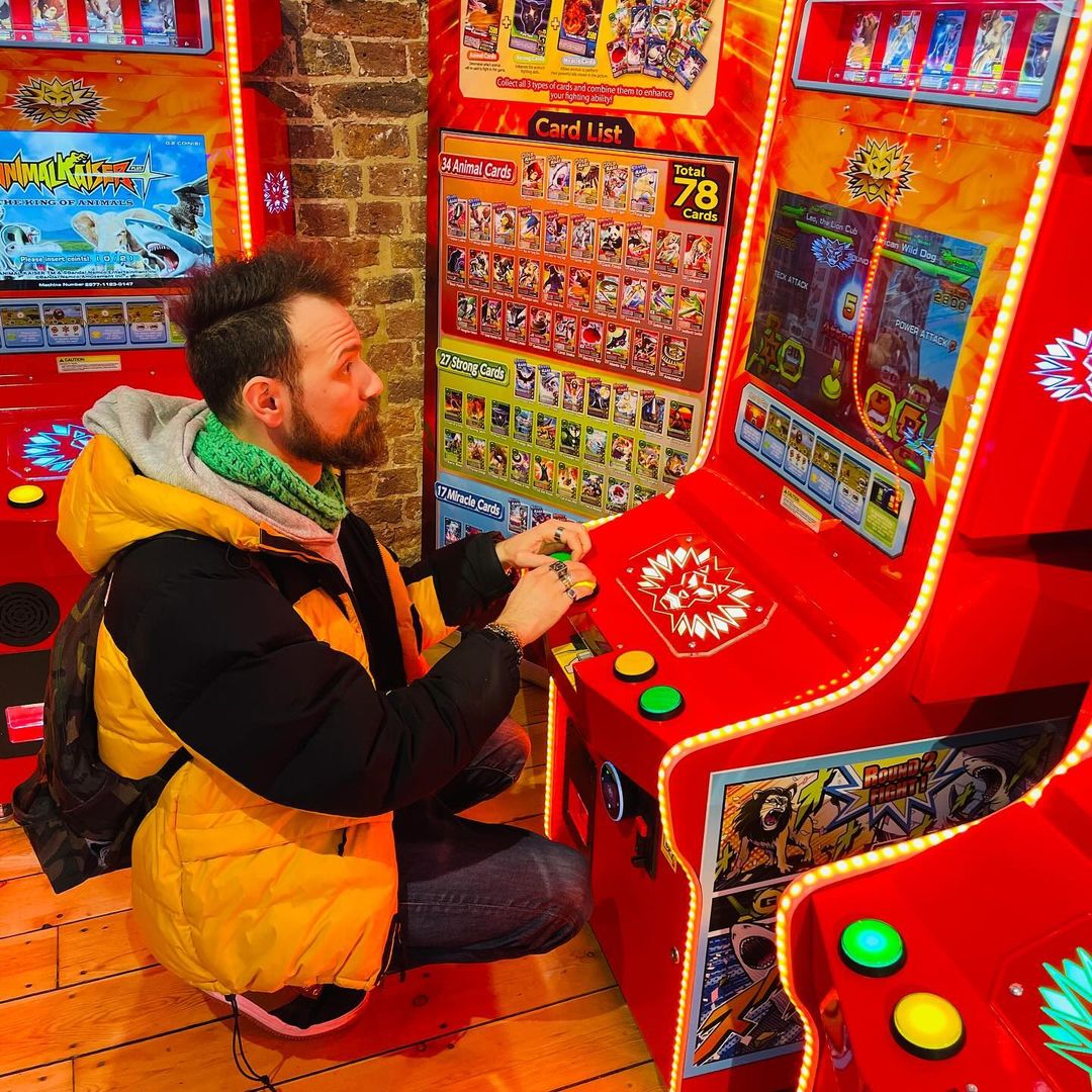 Bandai Namco Animal Kaiser Plus arcade card battle game with collectible card dispenser, HD animations, and kid-friendly cabinet.