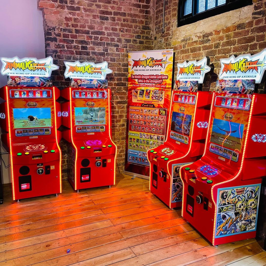 Bandai Namco Animal Kaiser Plus arcade card battle game with collectible card dispenser, HD animations, and kid-friendly cabinet.