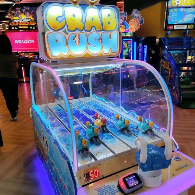Bandai Namco Crab Rush arcade game with moving crab targets, two-player shooter action, and under-the-sea theme.