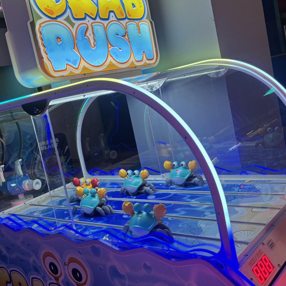 Bandai Namco Crab Rush arcade game with moving crab targets, two-player shooter action, and under-the-sea theme.