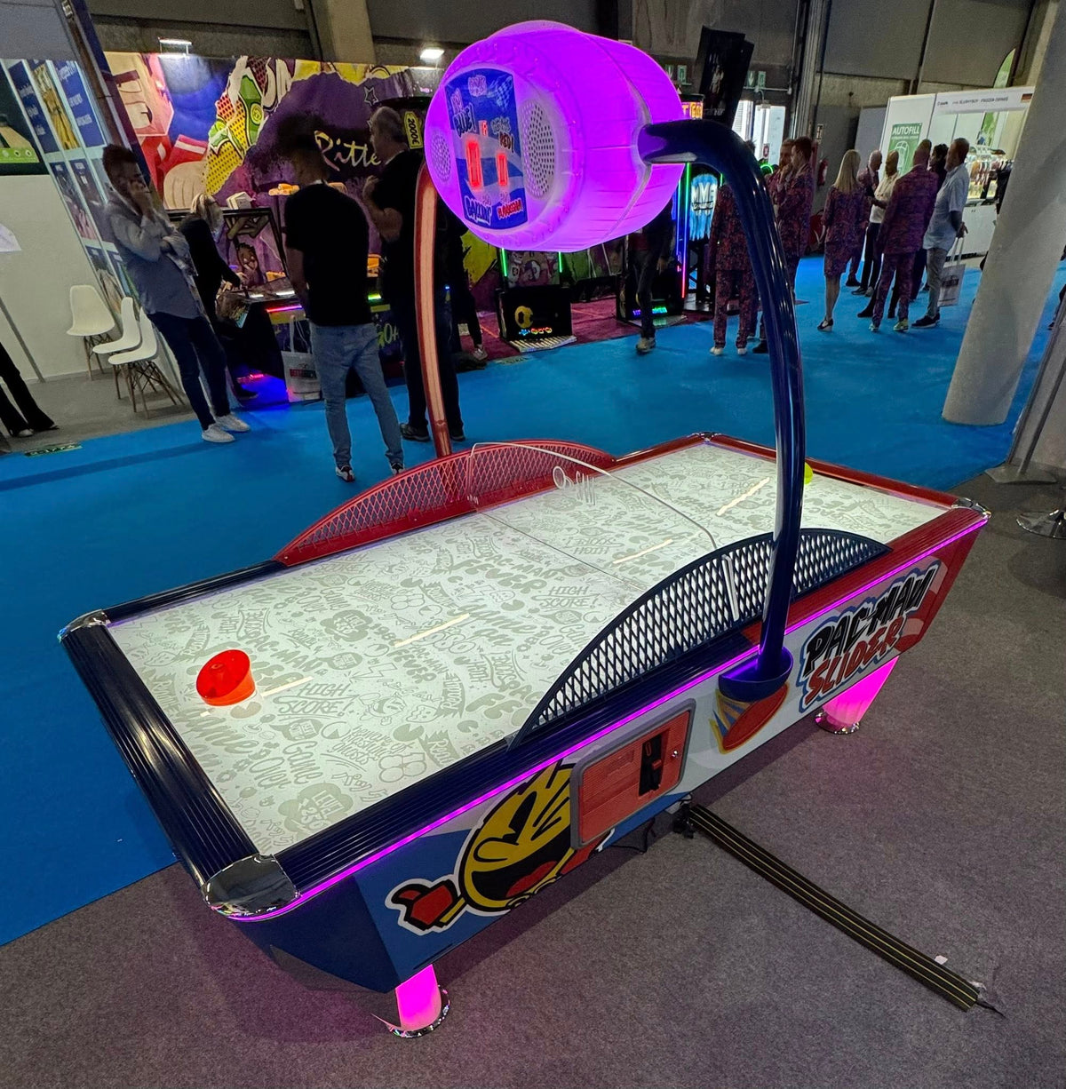 Pac-Man Slider air hockey table with LED color-changing playfield, classic Pac-Man sounds, and durable coin-operated design.