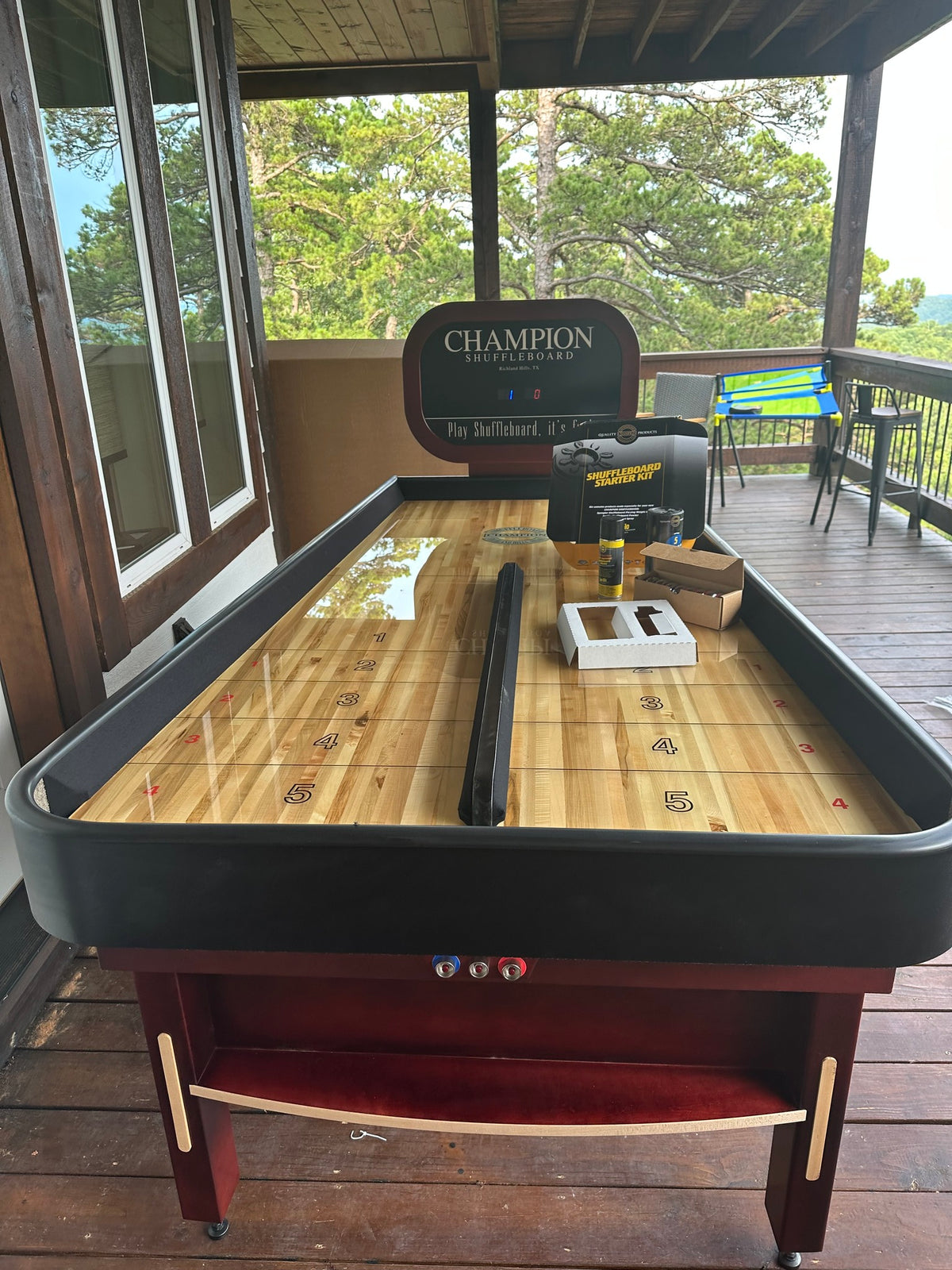 Bank Shot compact shuffleboard table with bumper play, precision scoring, and champion-quality craftsmanship