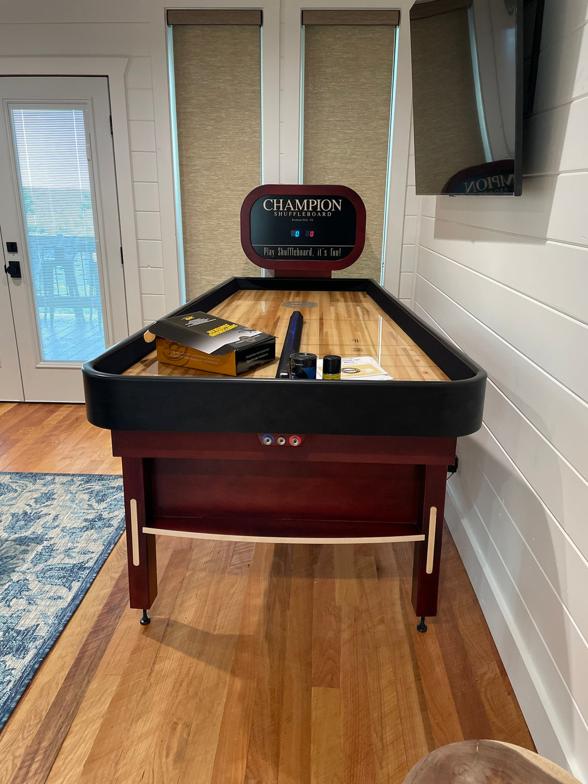 Bank Shot compact shuffleboard table with bumper play, precision scoring, and champion-quality craftsmanship