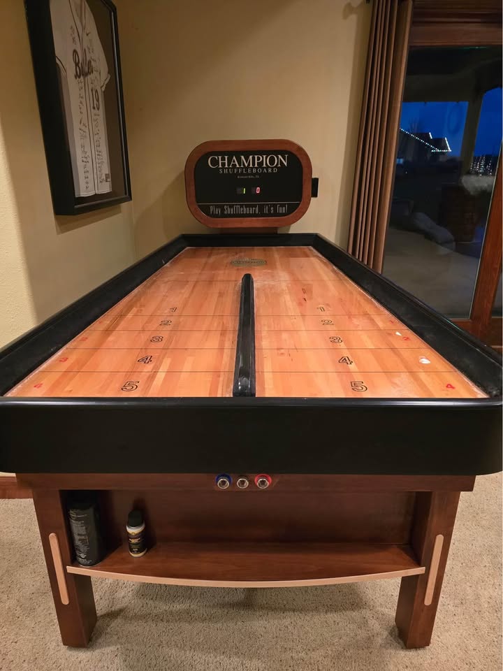 Bank Shot compact shuffleboard table with bumper play, precision scoring, and champion-quality craftsmanship
