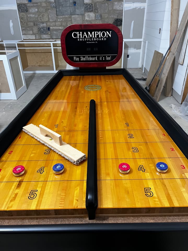 Bank Shot compact shuffleboard table with bumper play, precision scoring, and champion-quality craftsmanship
