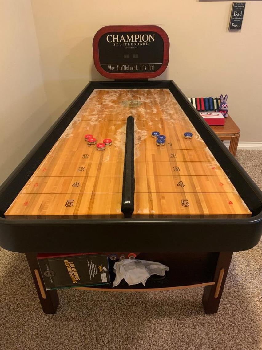 Bank Shot compact shuffleboard table with bumper play, precision scoring, and champion-quality craftsmanship