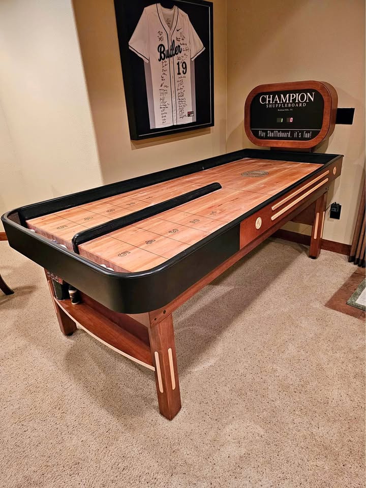 Bank Shot compact shuffleboard table with bumper play, precision scoring, and champion-quality craftsmanship