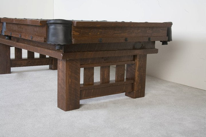 Close-up of handcrafted log legs on Viking Log Furniture Barnwood Cheyenne rustic pool table