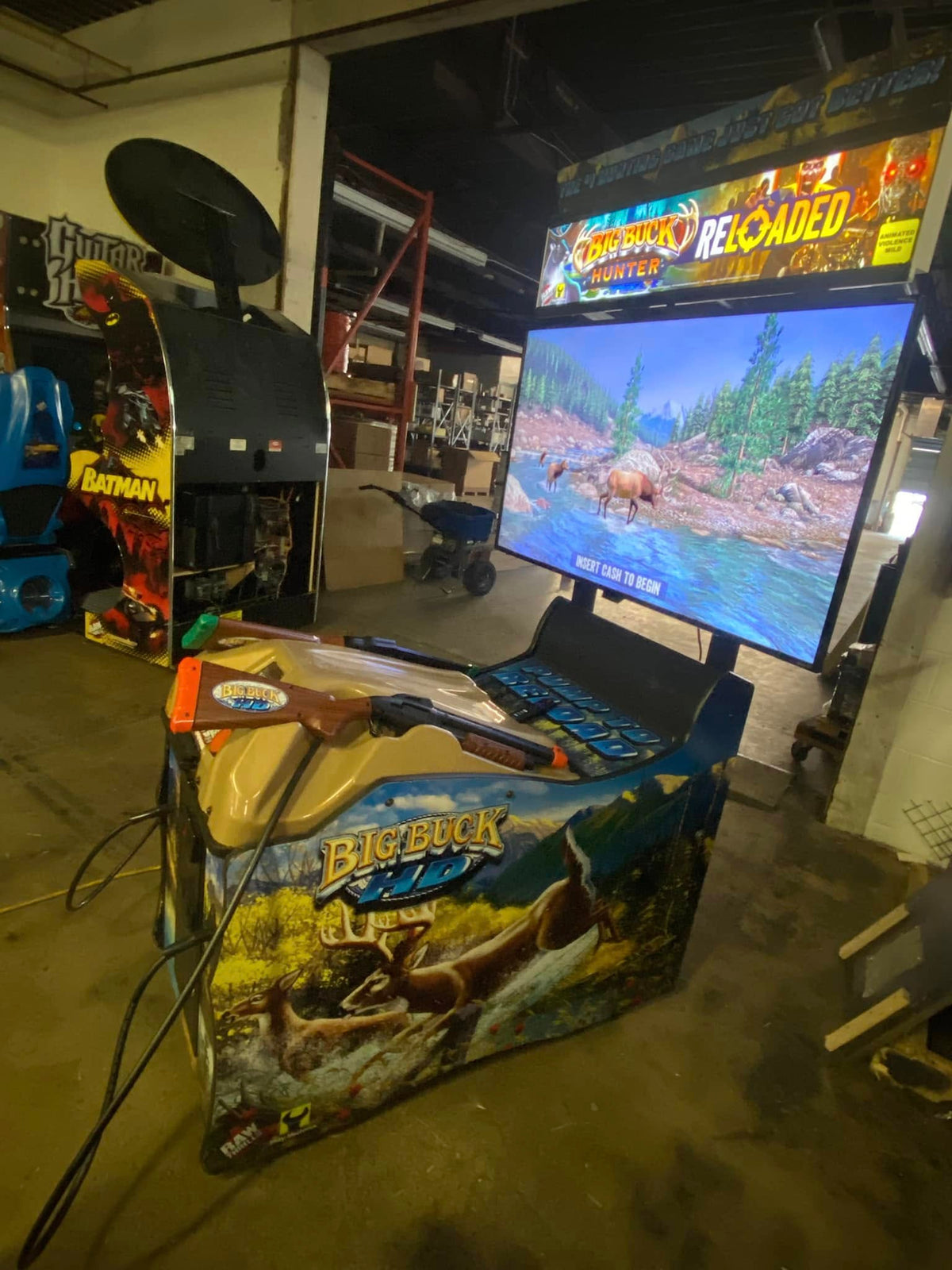 Front view of Big Buck Hunter Reloaded Panorama arcade machine showing widescreen hunting gameplay