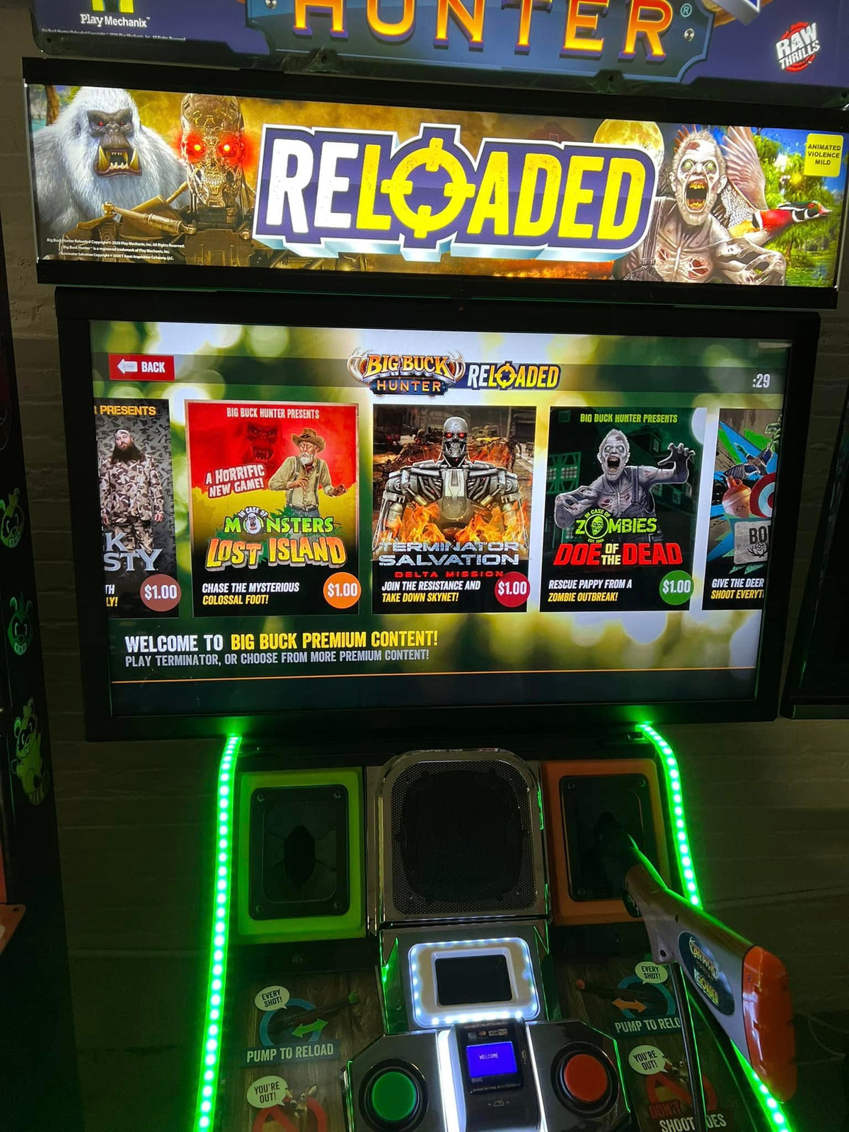 closeup view of Big Buck Hunter Reloaded Panorama arcade machine showing widescreen hunting gameplay