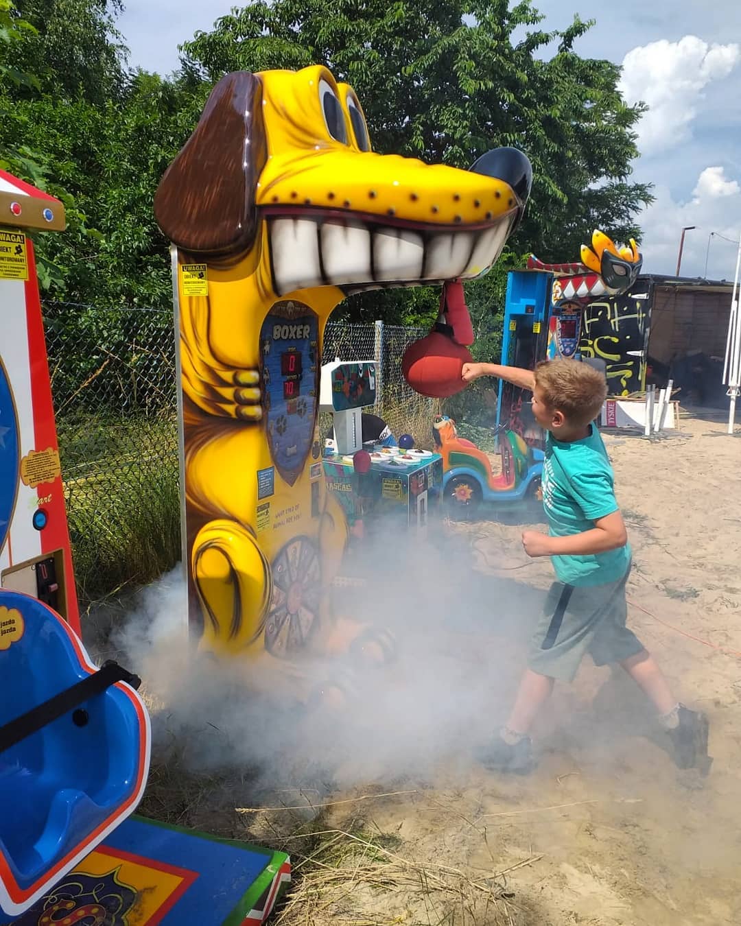 Boxer Dog kids boxing machine with fun animal sound effects and playful arcade attraction design.
