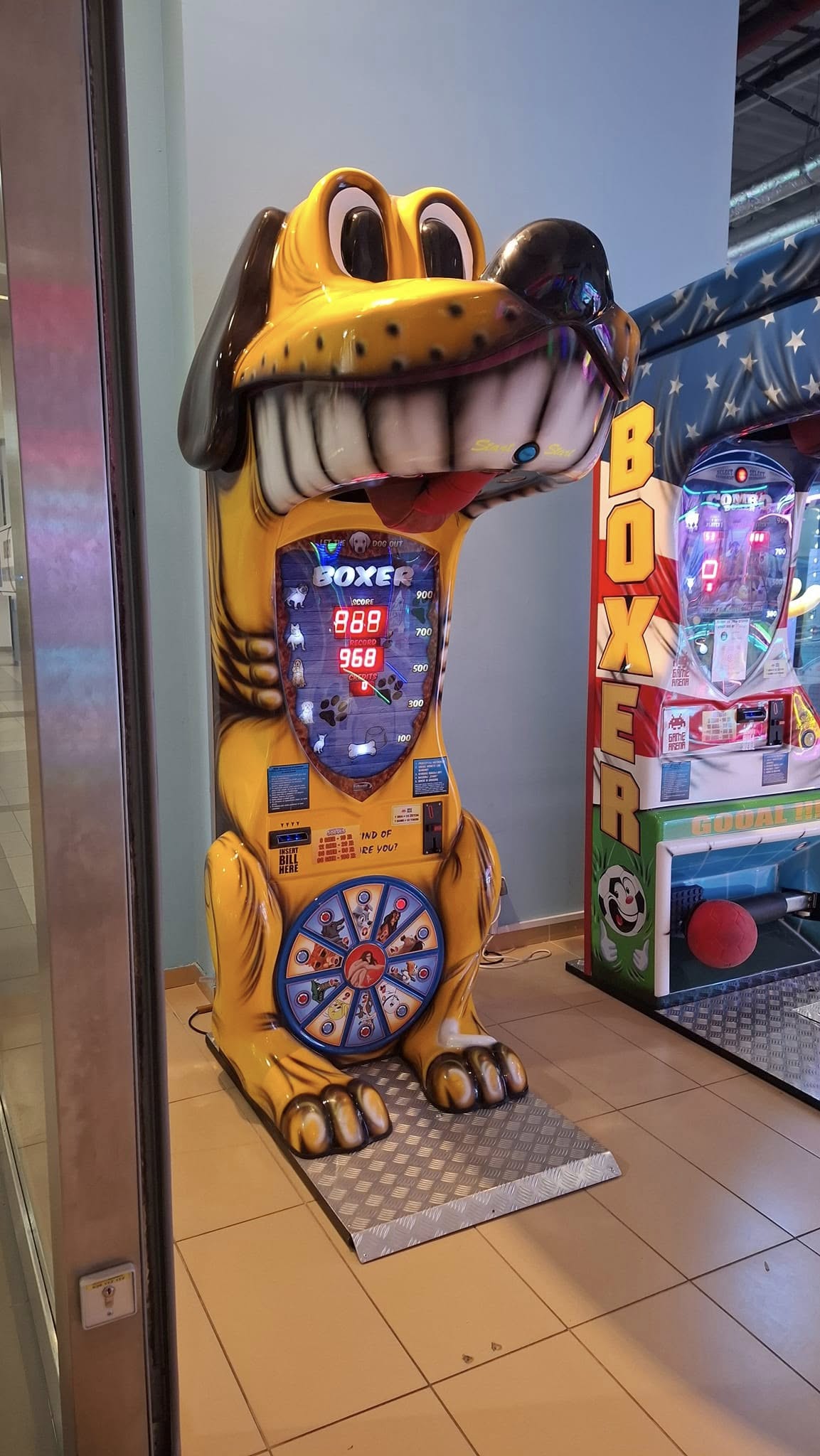 Boxer Dog kids boxing machine with fun animal sound effects and playful arcade attraction design.