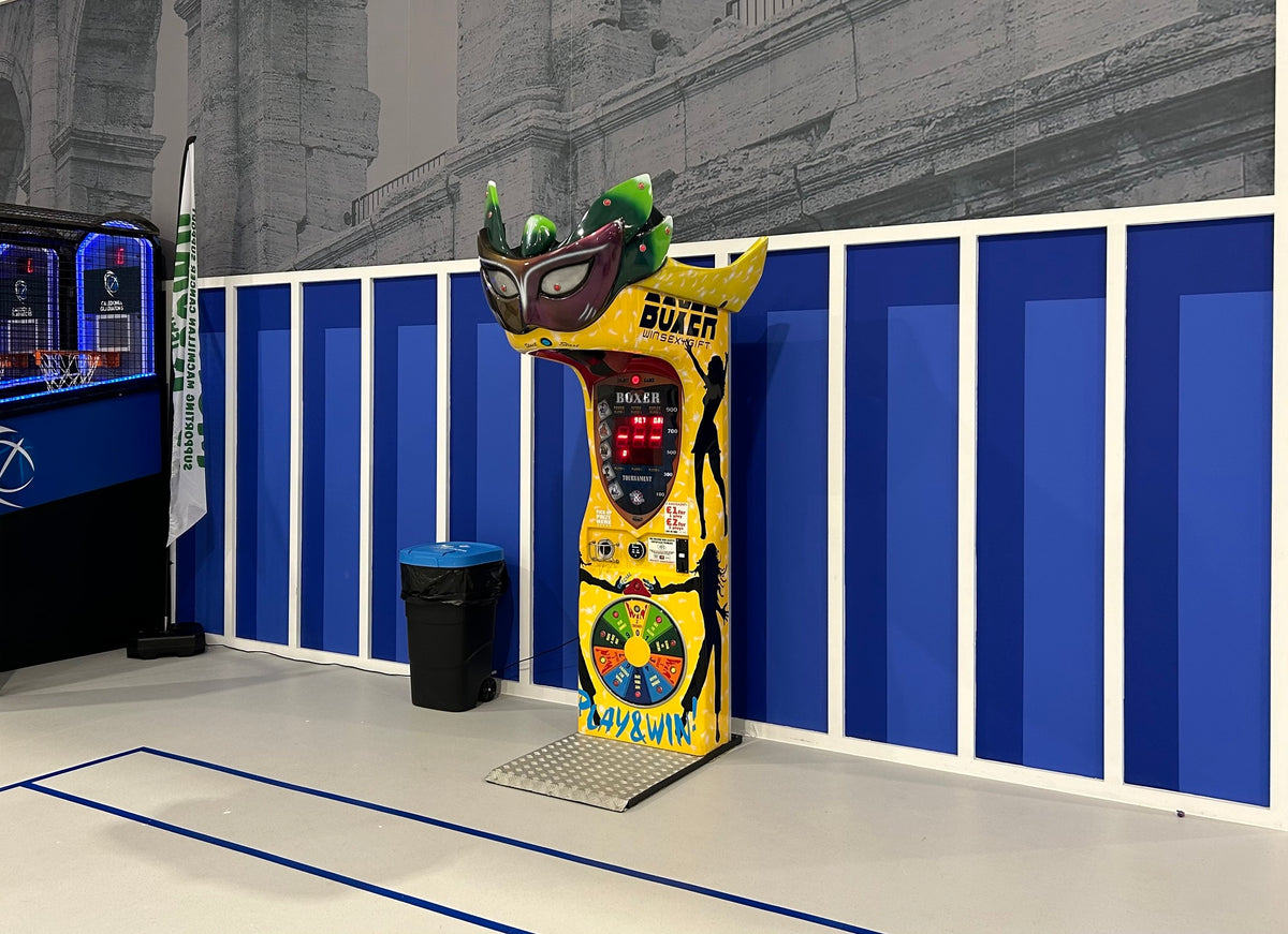 Boxer Mask redemption boxing machine with Venetian mask design and prize capsule dispenser.