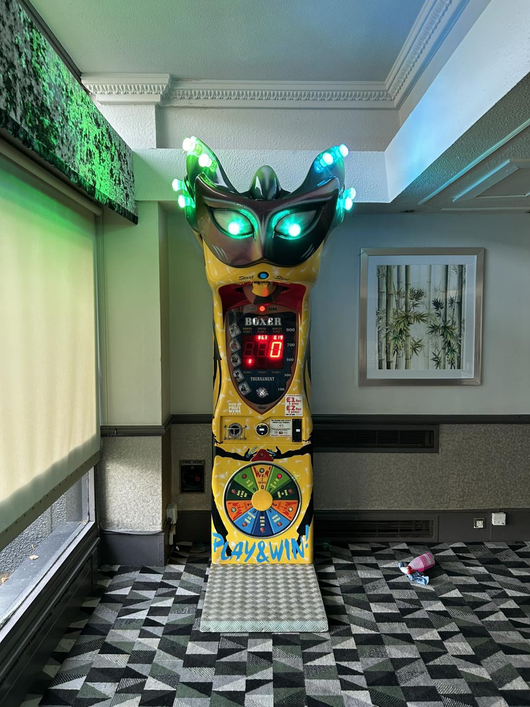 Boxer Mask redemption boxing machine with Venetian mask design and prize capsule dispenser.