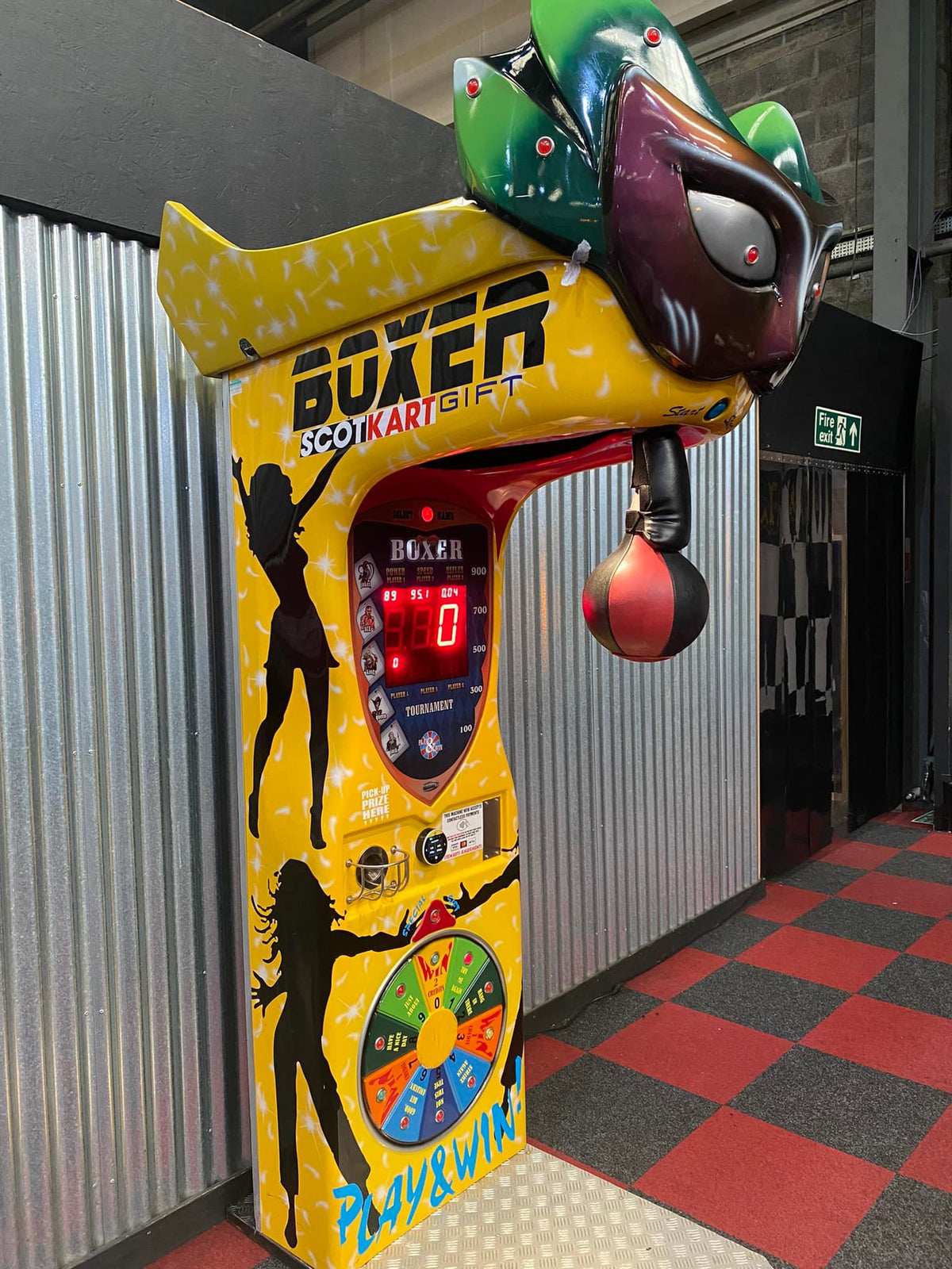 Boxer Mask redemption boxing machine with Venetian mask design and prize capsule dispenser.