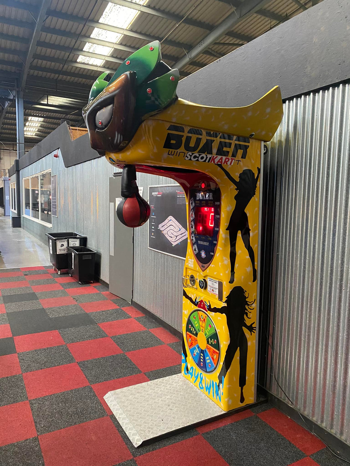 Boxer Mask redemption boxing machine with Venetian mask design and prize capsule dispenser.