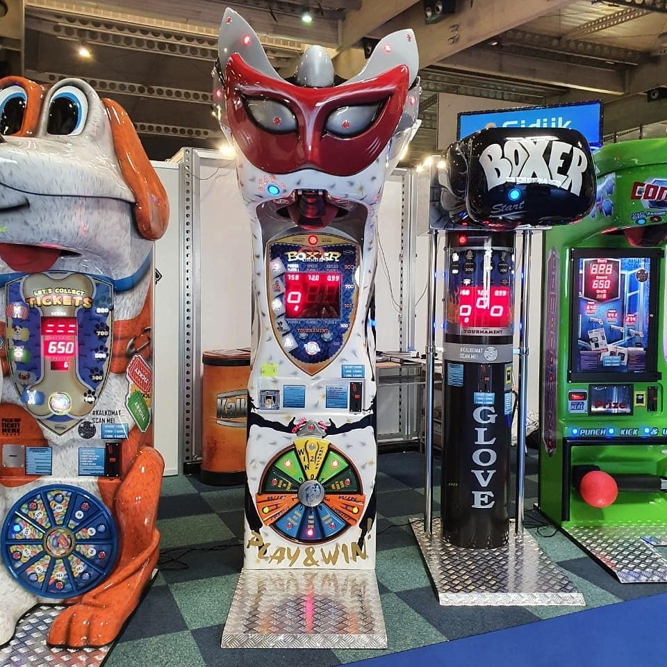 Boxer Mask redemption boxing machine with Venetian mask design and prize capsule dispenser.