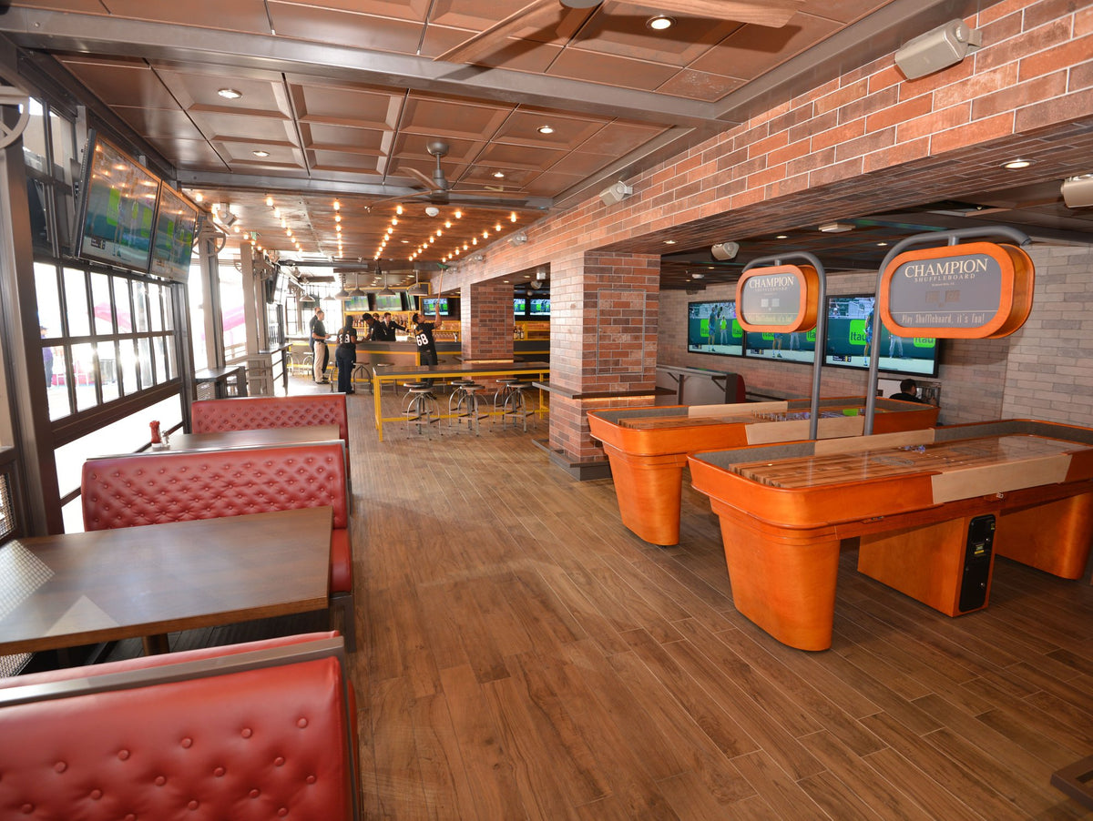 Capri shuffleboard table combining modern elegant design with classic smooth playfield and precision scoring