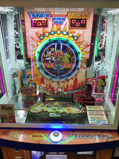 Bandai Namco DC Superheroes 4 Player Pusher Arcade Game – Token &amp; Card Redemption | Collectible Hero &amp; Villain Cards | Bonus Drop Feature | Official DC Comics.