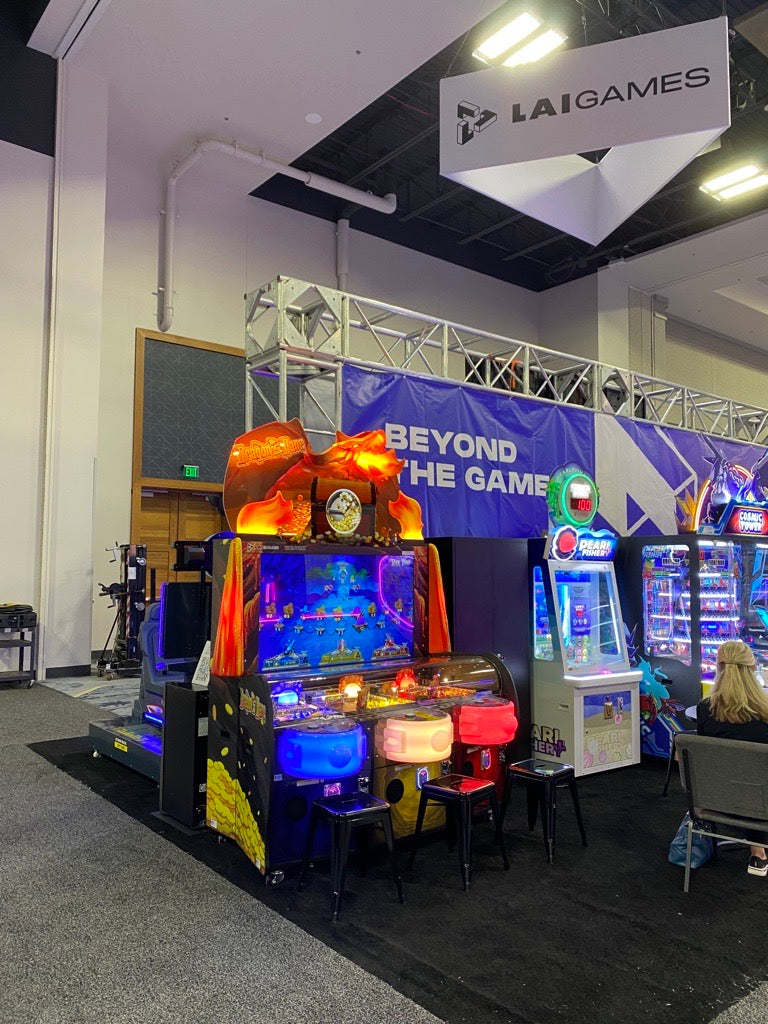 Dragon’s Bane 3-player coin pusher arcade machine with dragon-themed design and mixed analog-digital gameplay.