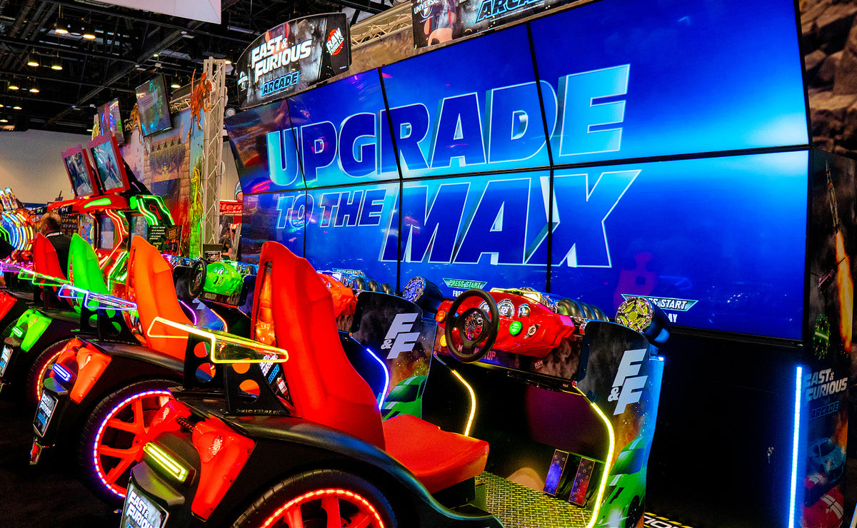Fast & Furious Thrill-D motion racing arcade machine with dual 65-inch UHD screens, motion simulator, and 1–8 player linked cabinets