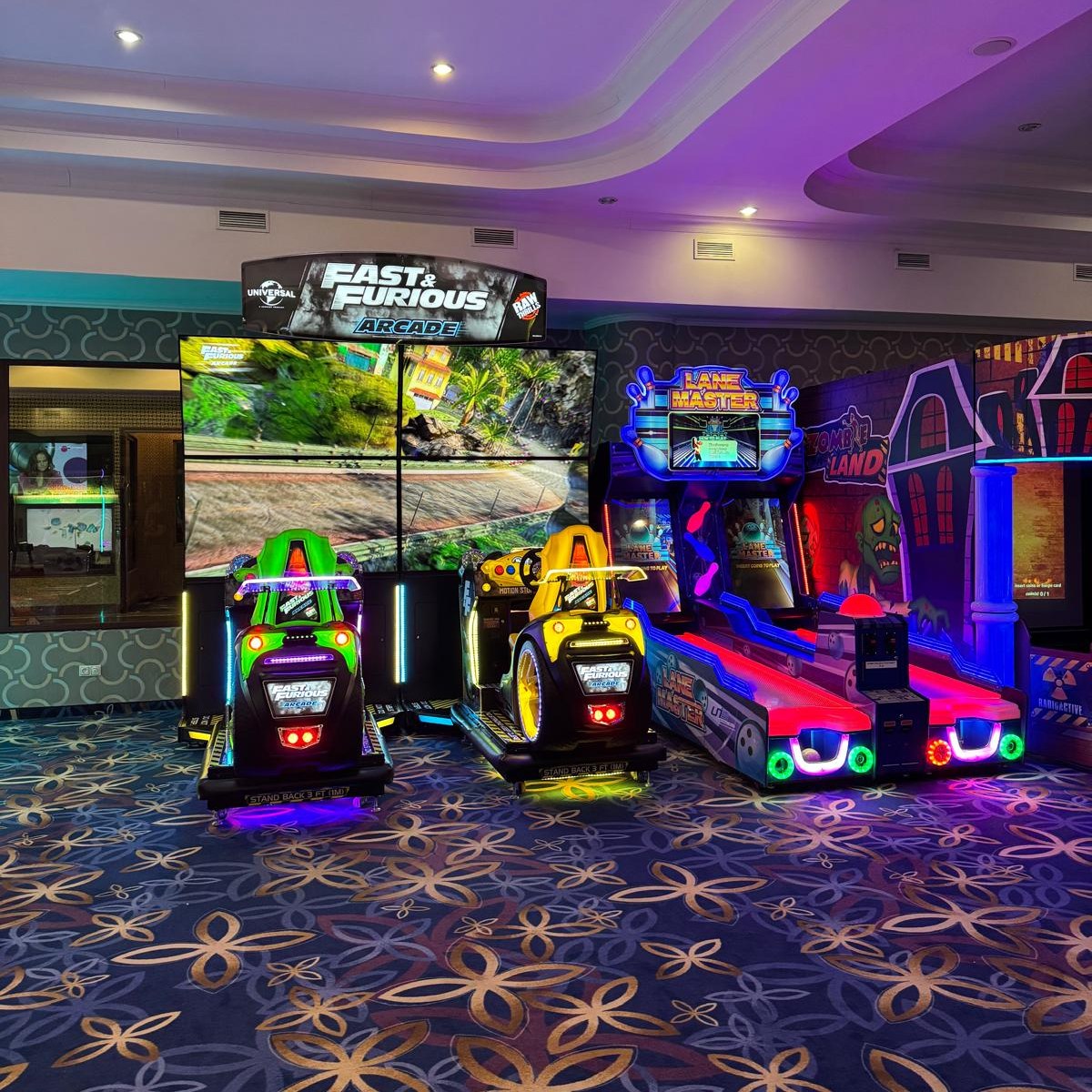 Fast & Furious Thrill-D motion racing arcade machine with dual 65-inch UHD screens, motion simulator, and 1–8 player linked cabinets