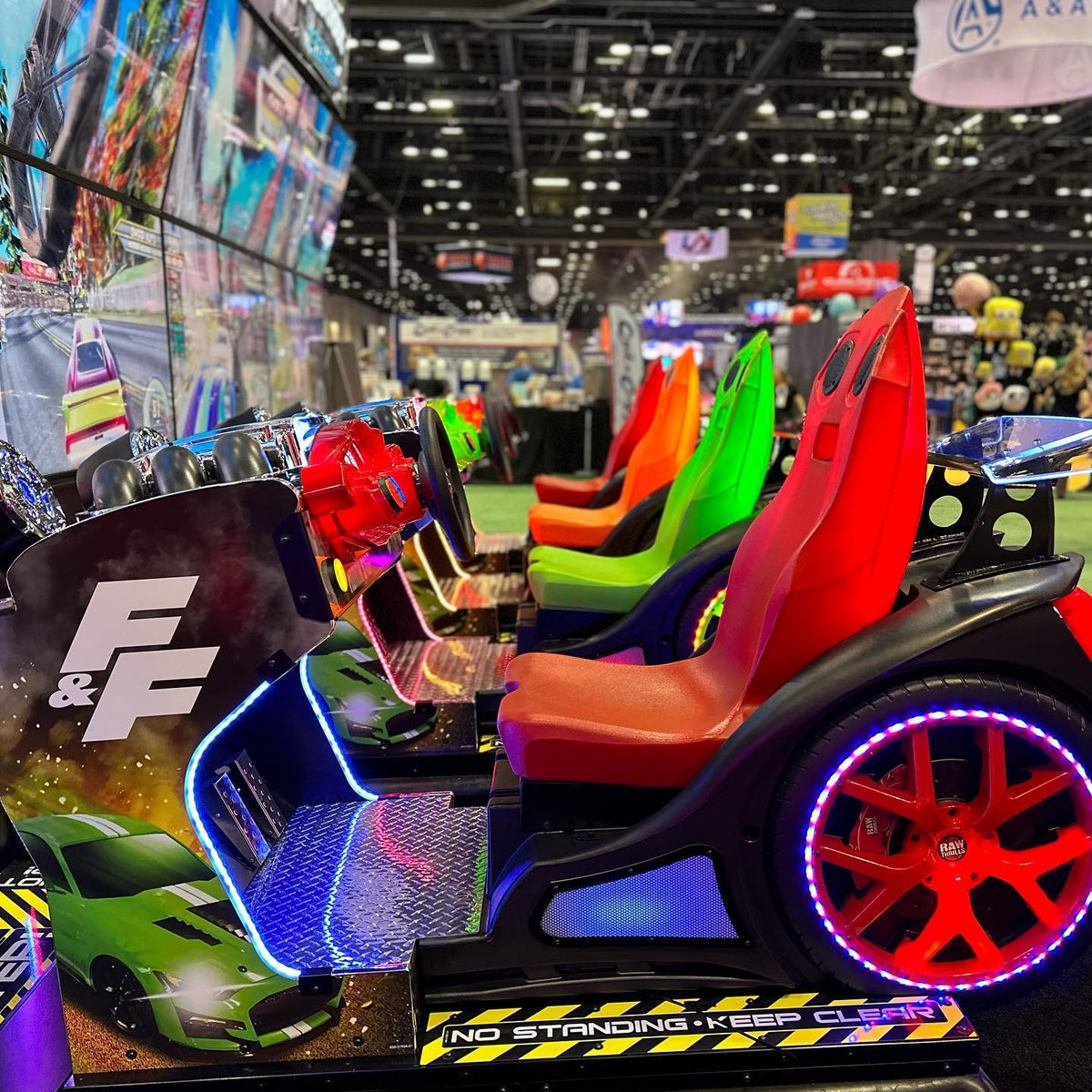 Fast & Furious Thrill-D motion racing arcade machine with dual 65-inch UHD screens, motion simulator, and 1–8 player linked cabinets