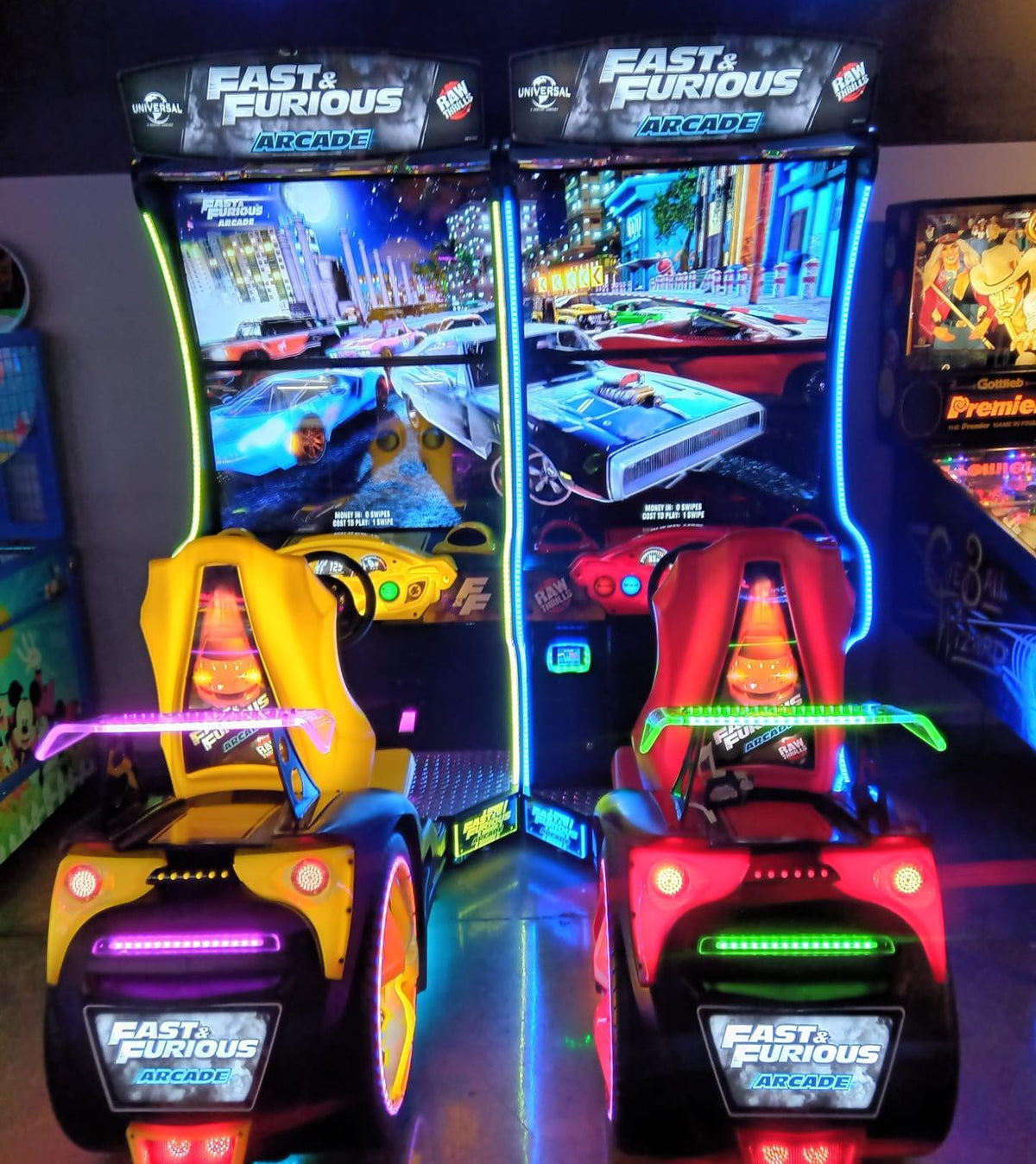 Front view of Fast and Furious 43 inch arcade racing machine showing high speed racing gameplay
