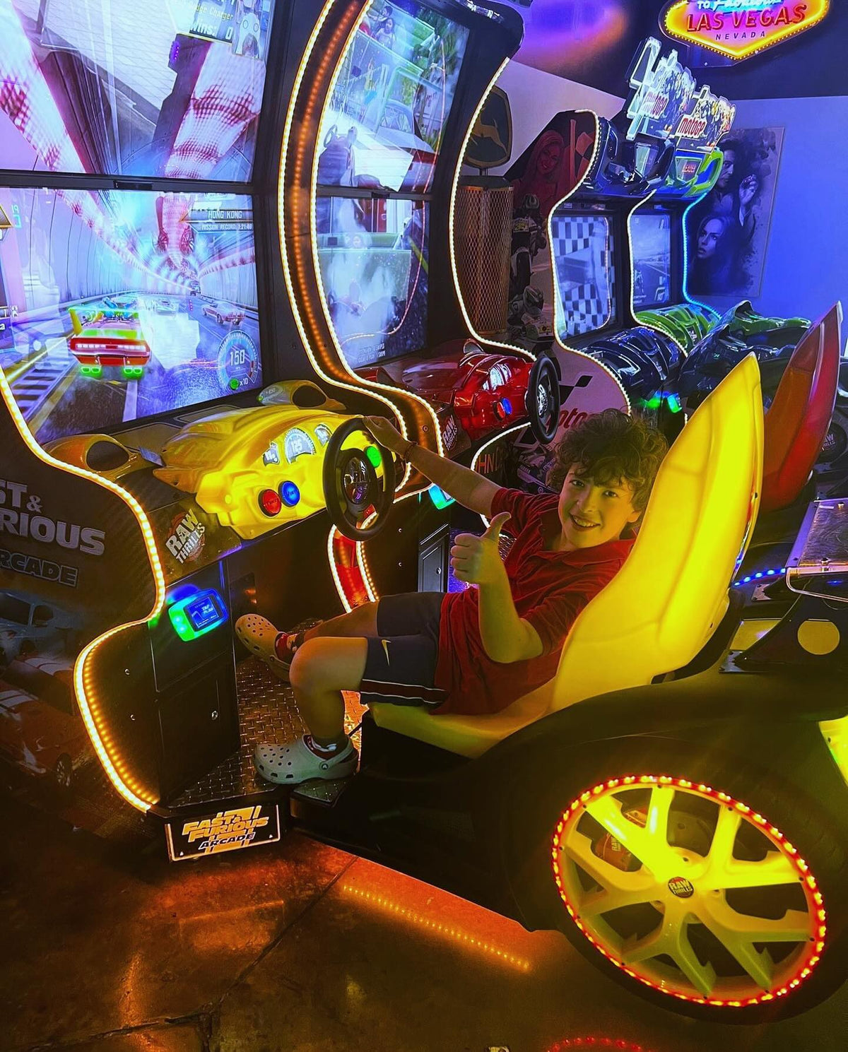 Side view of Fast and Furious arcade cabinet with compact design and illuminated cockpit