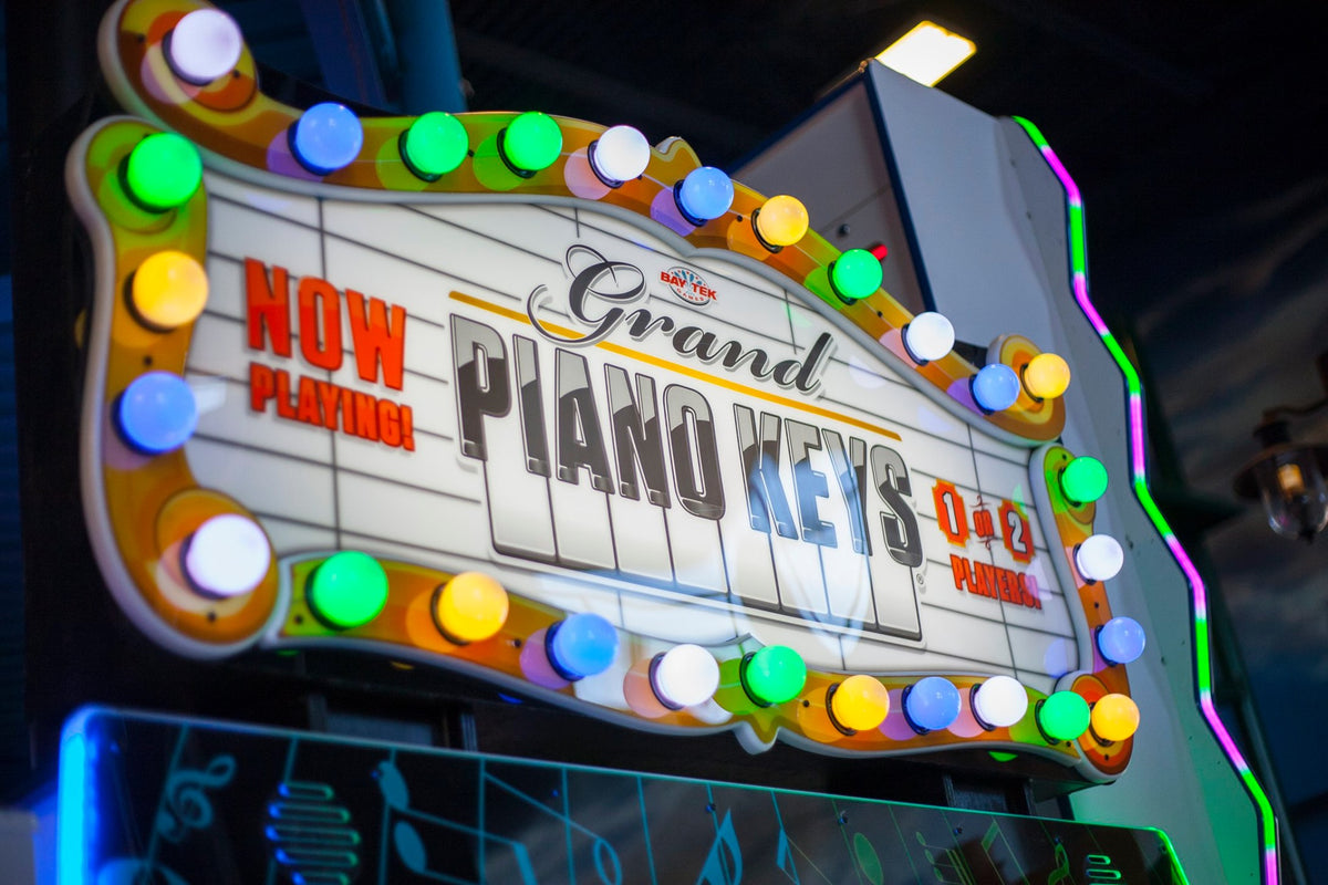 Grand Piano Keys arcade machine featuring musical skill gameplay and ticket redemption rewards.