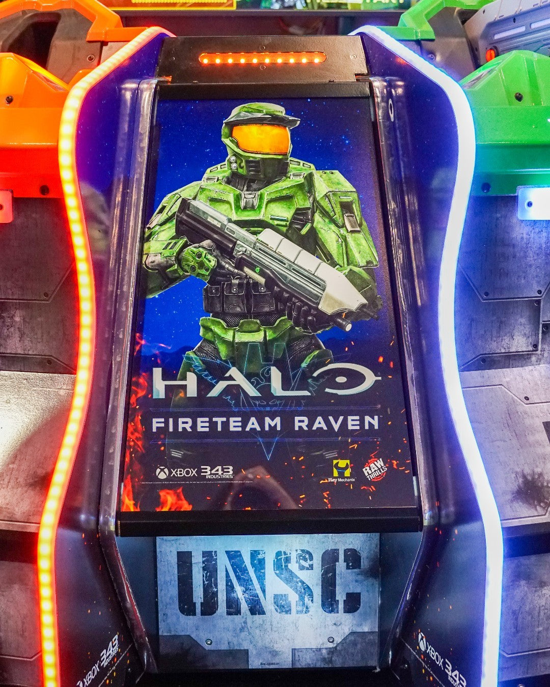 Raw Thrills Halo Fireteam Raven arcade game featuring six missions, immersive multiplayer action, and realistic gun controls.