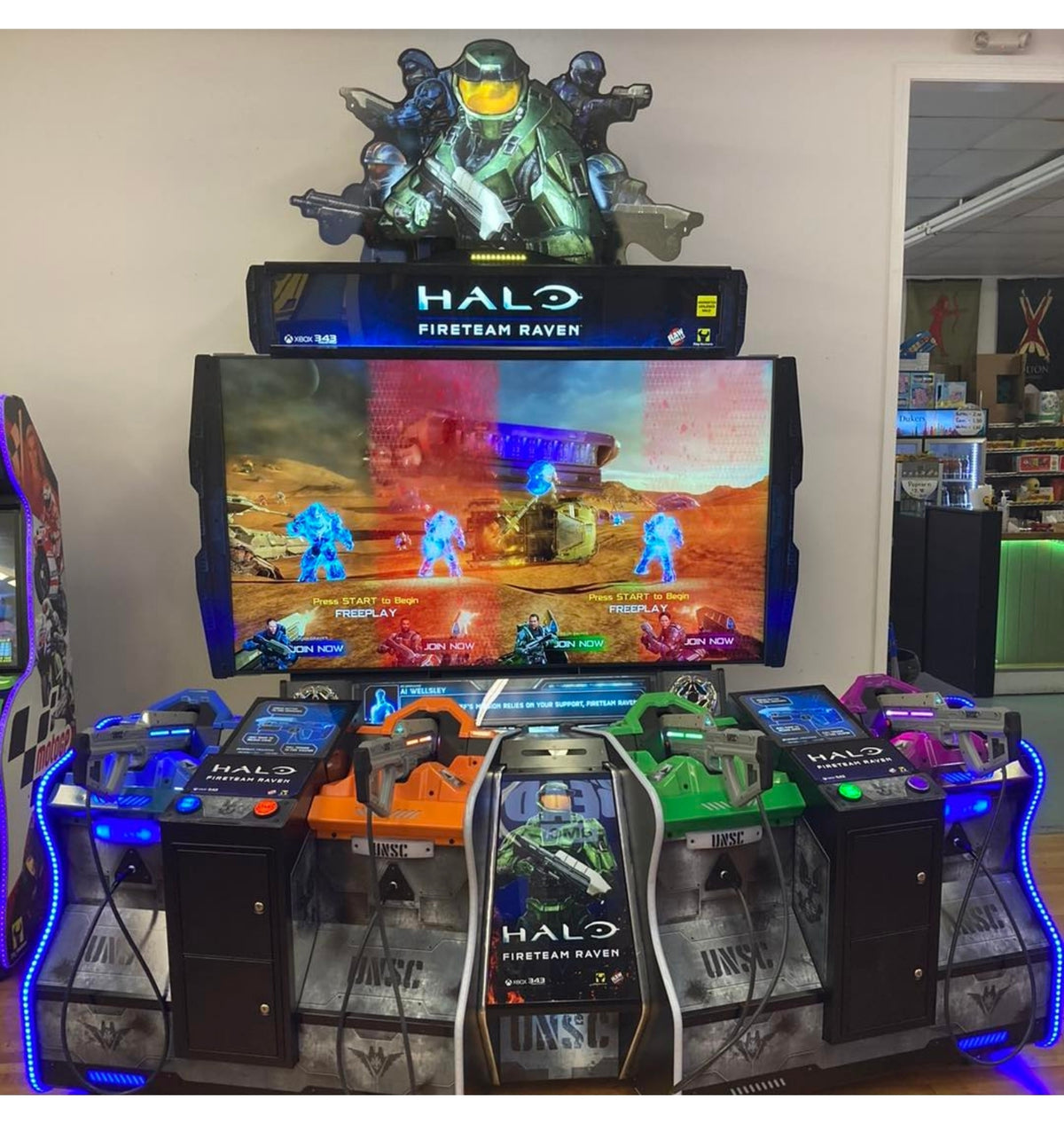 Raw Thrills Halo Fireteam Raven arcade game featuring six missions, immersive multiplayer action, and realistic gun controls.