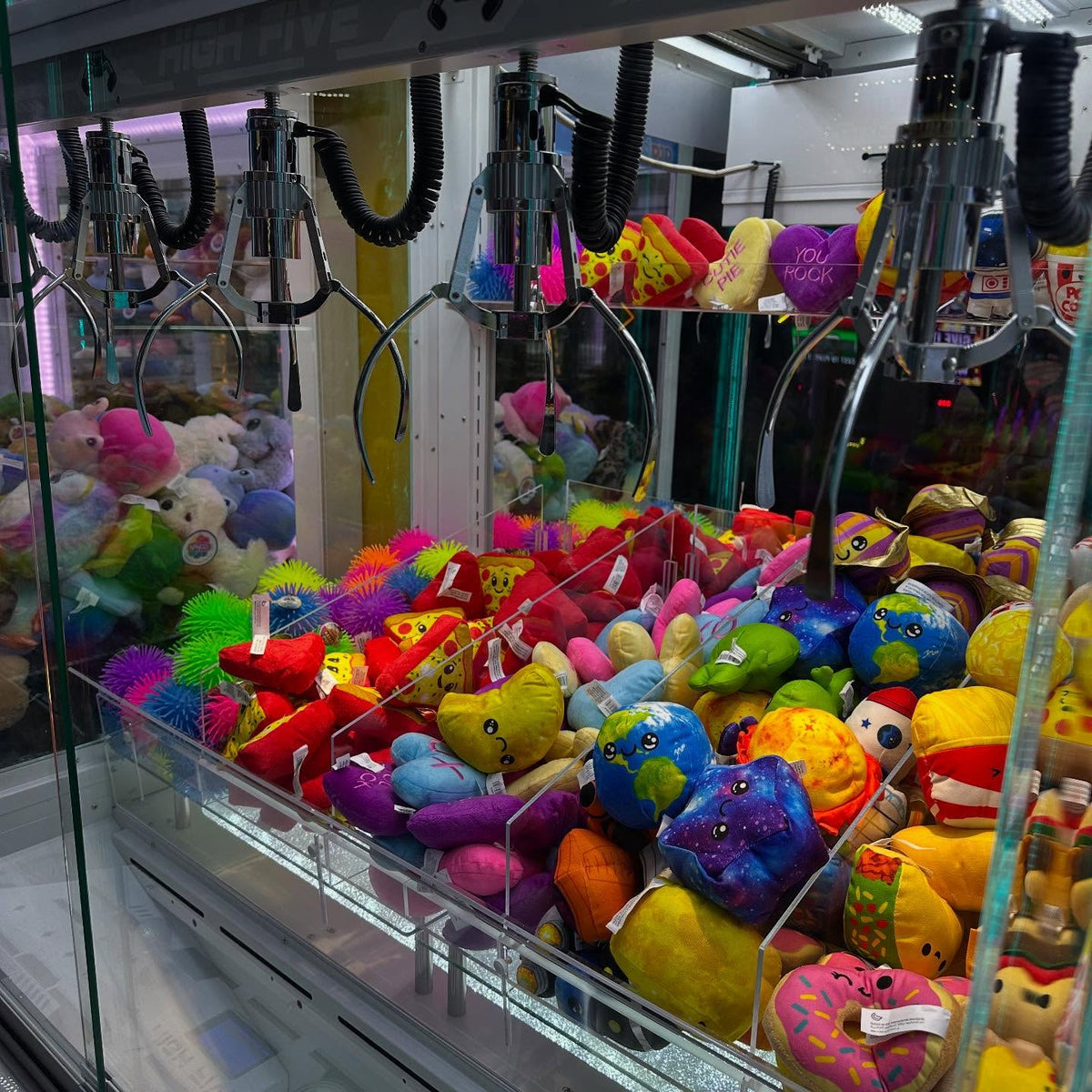 High Five five-claw prize crane arcade machine with large glass display and multi-claw prize system