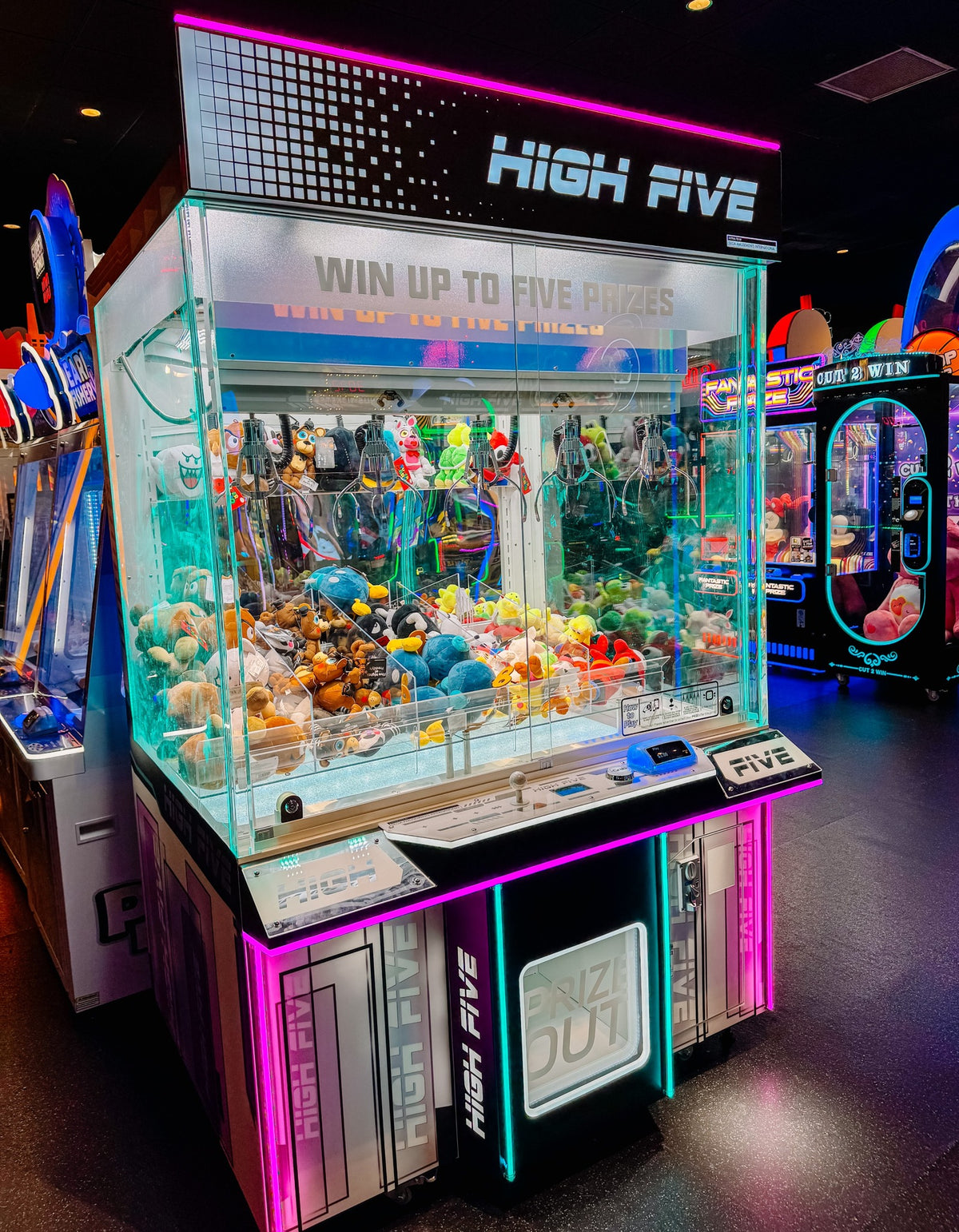 High Five five-claw prize crane arcade machine with large glass display and multi-claw prize system