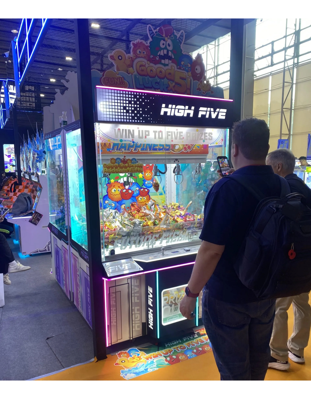 High Five five-claw prize crane arcade machine with large glass display and multi-claw prize system