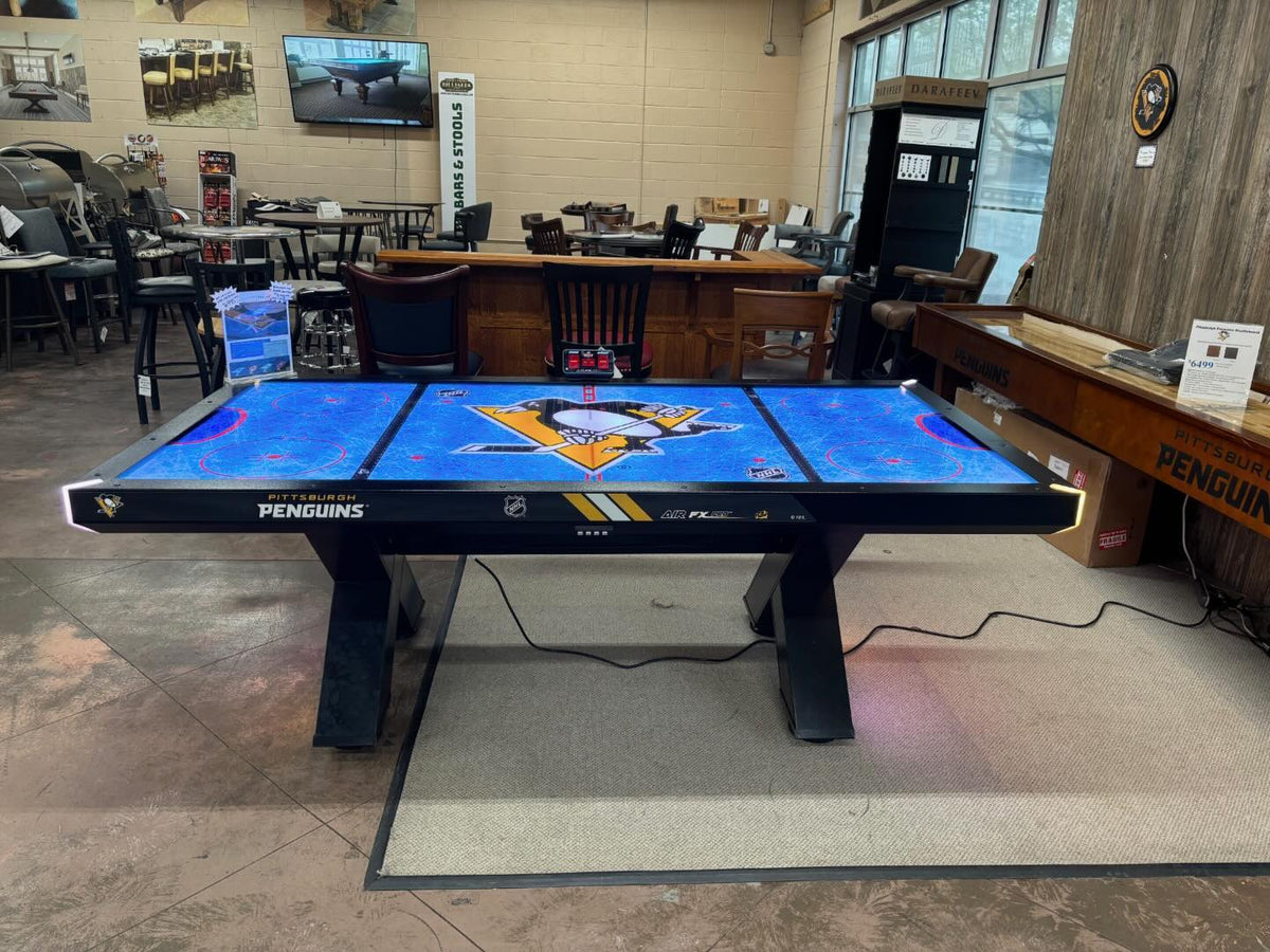 Home Air FX Pro 8-foot air hockey table with LED-backlit playfield, powder-coated steel frame, and hardwood accents.